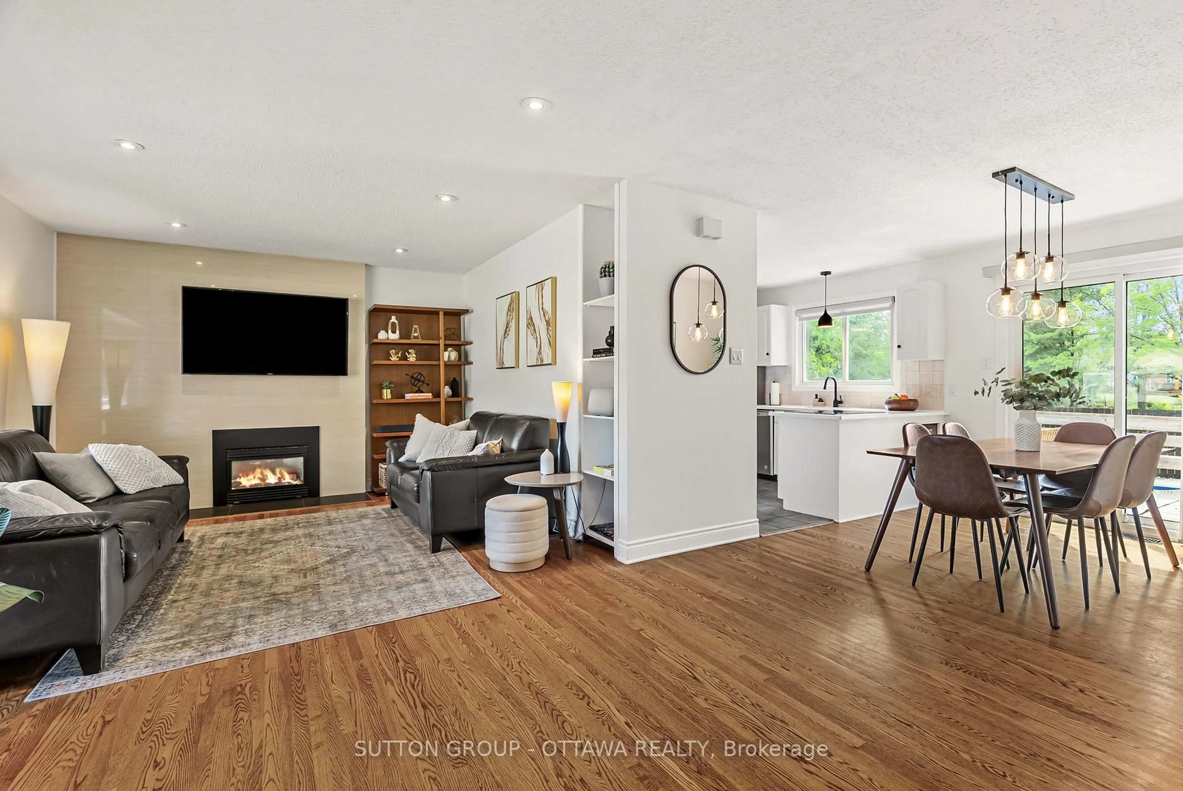 Living room with furniture, wood/laminate floor for 19 Donland Ave, Ottawa Ontario K2G 3A4