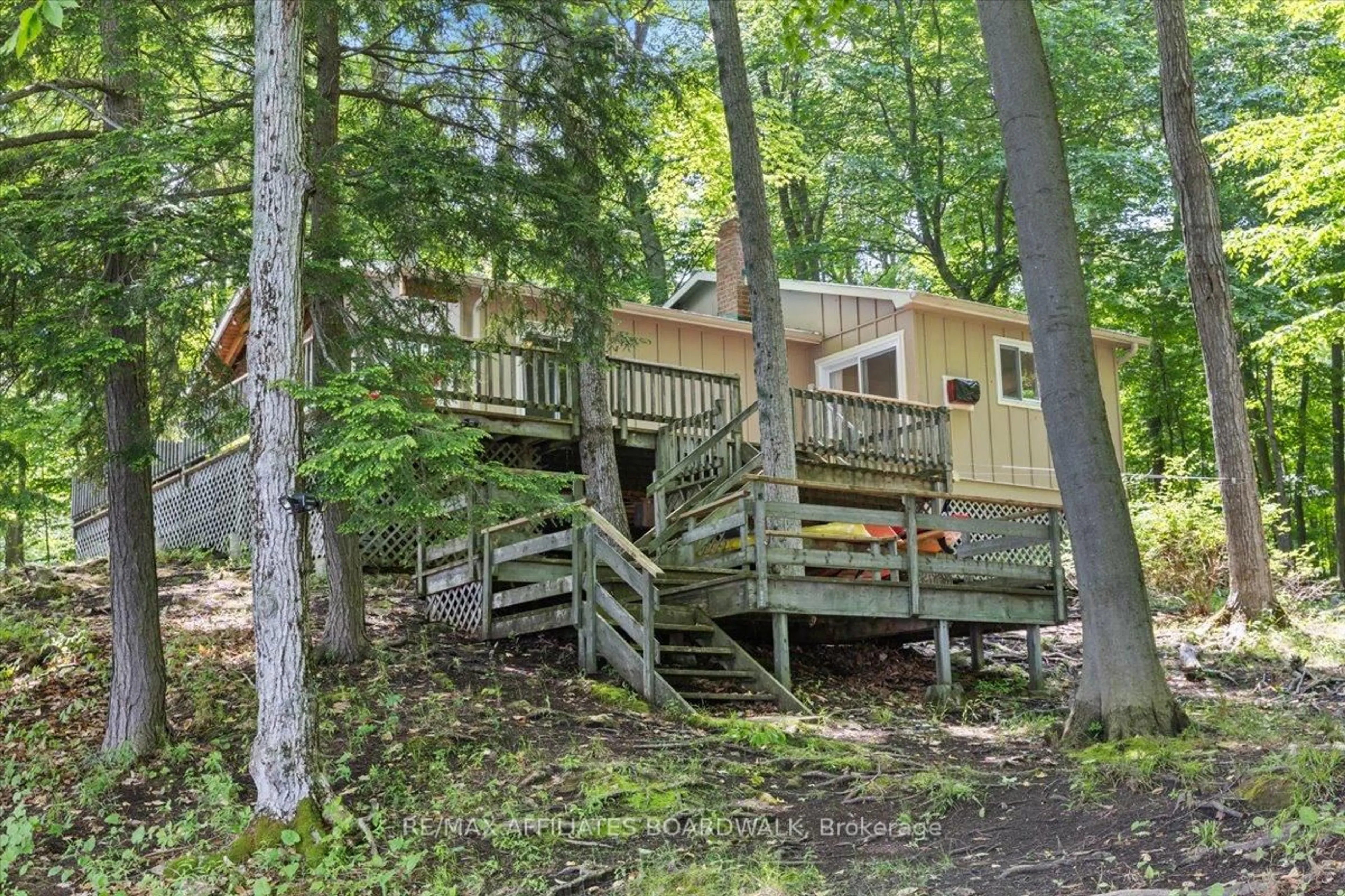 Patio, forest/trees view for 6296 Big Rideau Rd, Rideau Lakes Ontario K0G 1V0