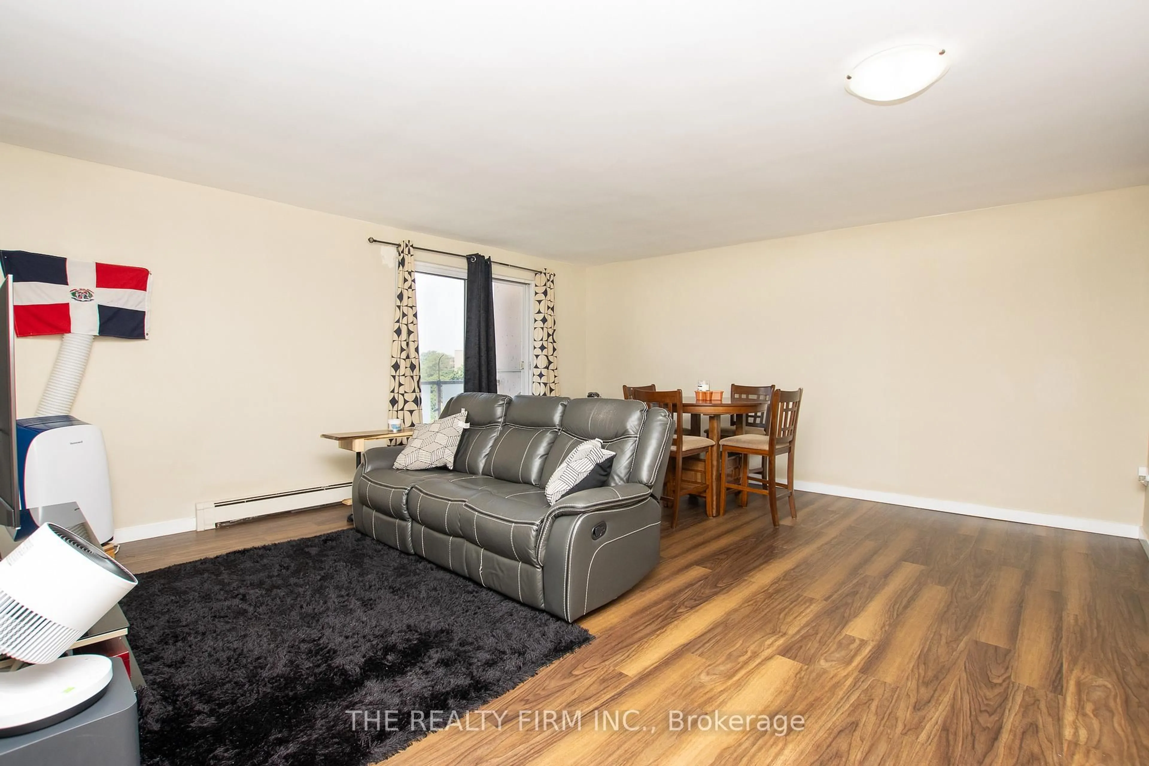 Living room with furniture, wood/laminate floor for 583 Mornington Ave #602, London East Ontario N5Y 3E9