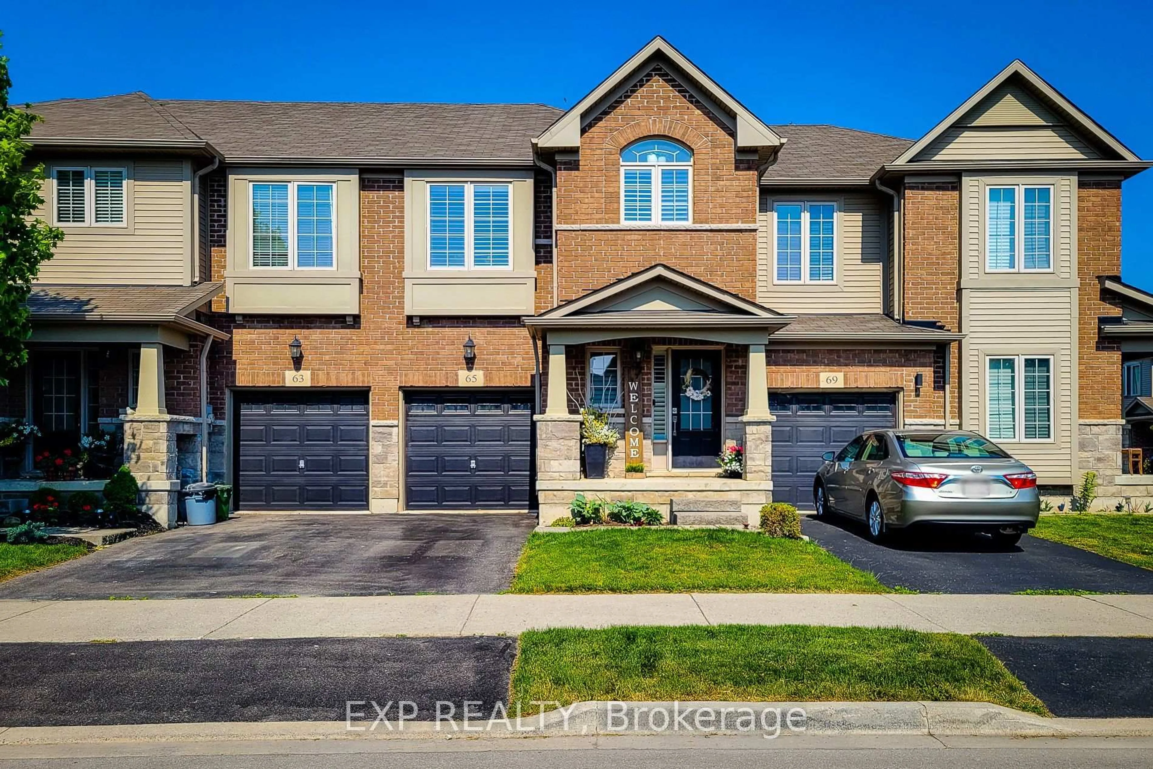 Home with brick exterior material, street for 65 Royal Winter Dr, Hamilton Ontario L0R 1C0