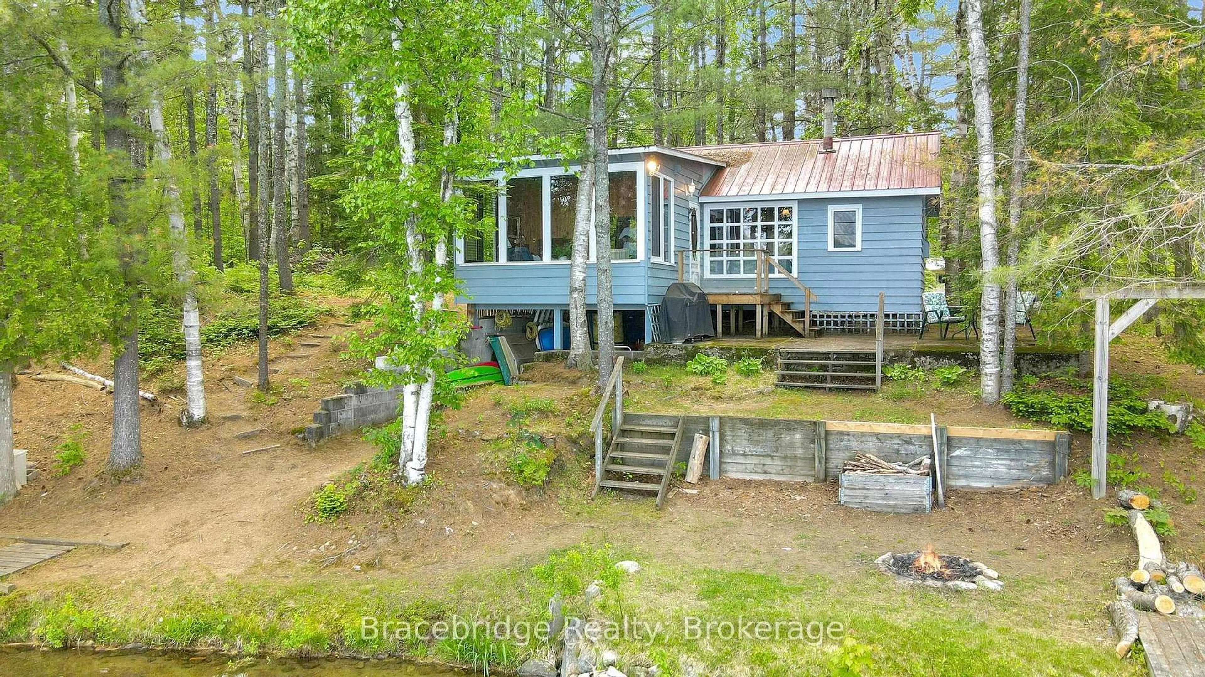 A pic from outside/outdoor area/front of a property/back of a property/a pic from drone, water/lake/river/ocean view for 1175 Kendrick Creek Lane, Minden Hills Ontario K0M 2K0