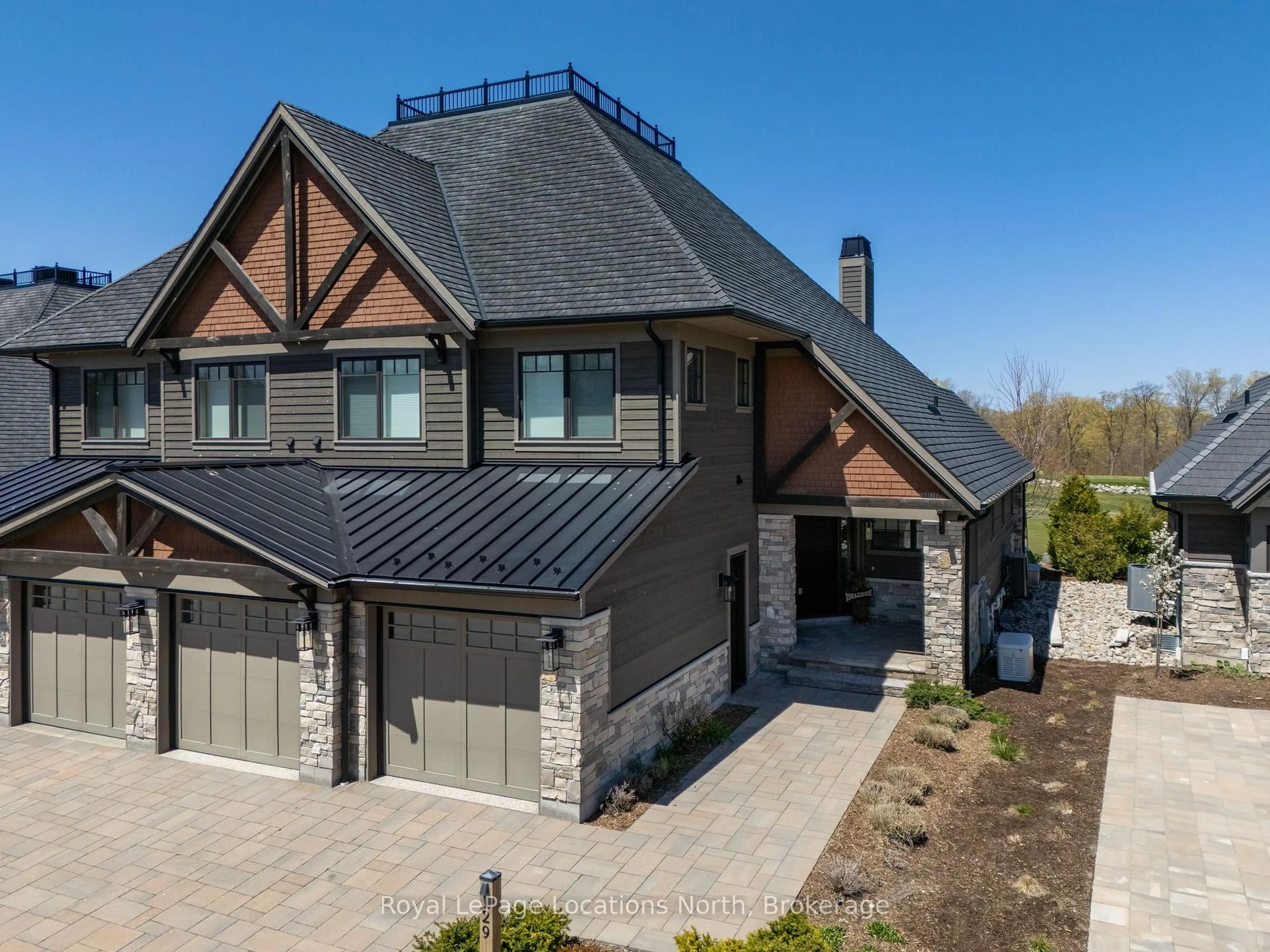 Home with brick exterior material, street for 129 Georgian Bay Lane, Blue Mountains Ontario N0H 1J0
