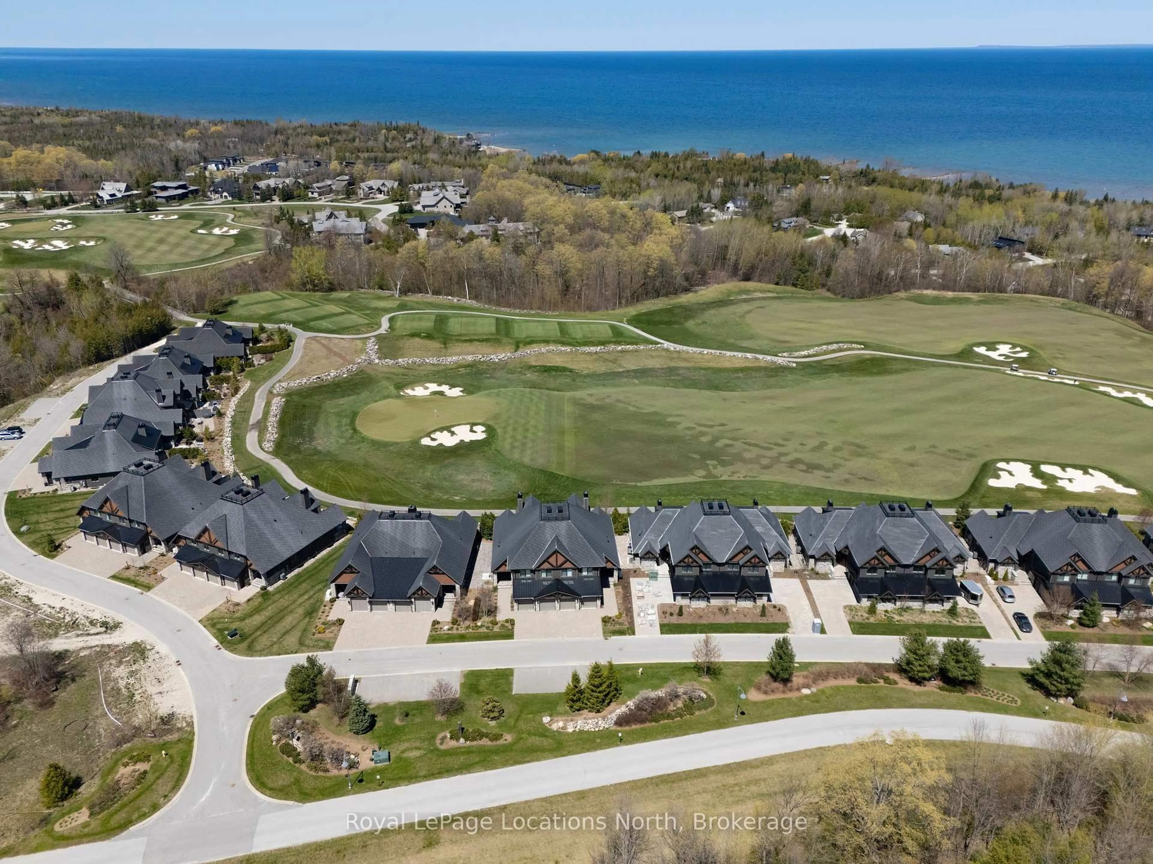 A pic from outside/outdoor area/front of a property/back of a property/a pic from drone, water/lake/river/ocean view for 129 Georgian Bay Lane, Blue Mountains Ontario N0H 1J0