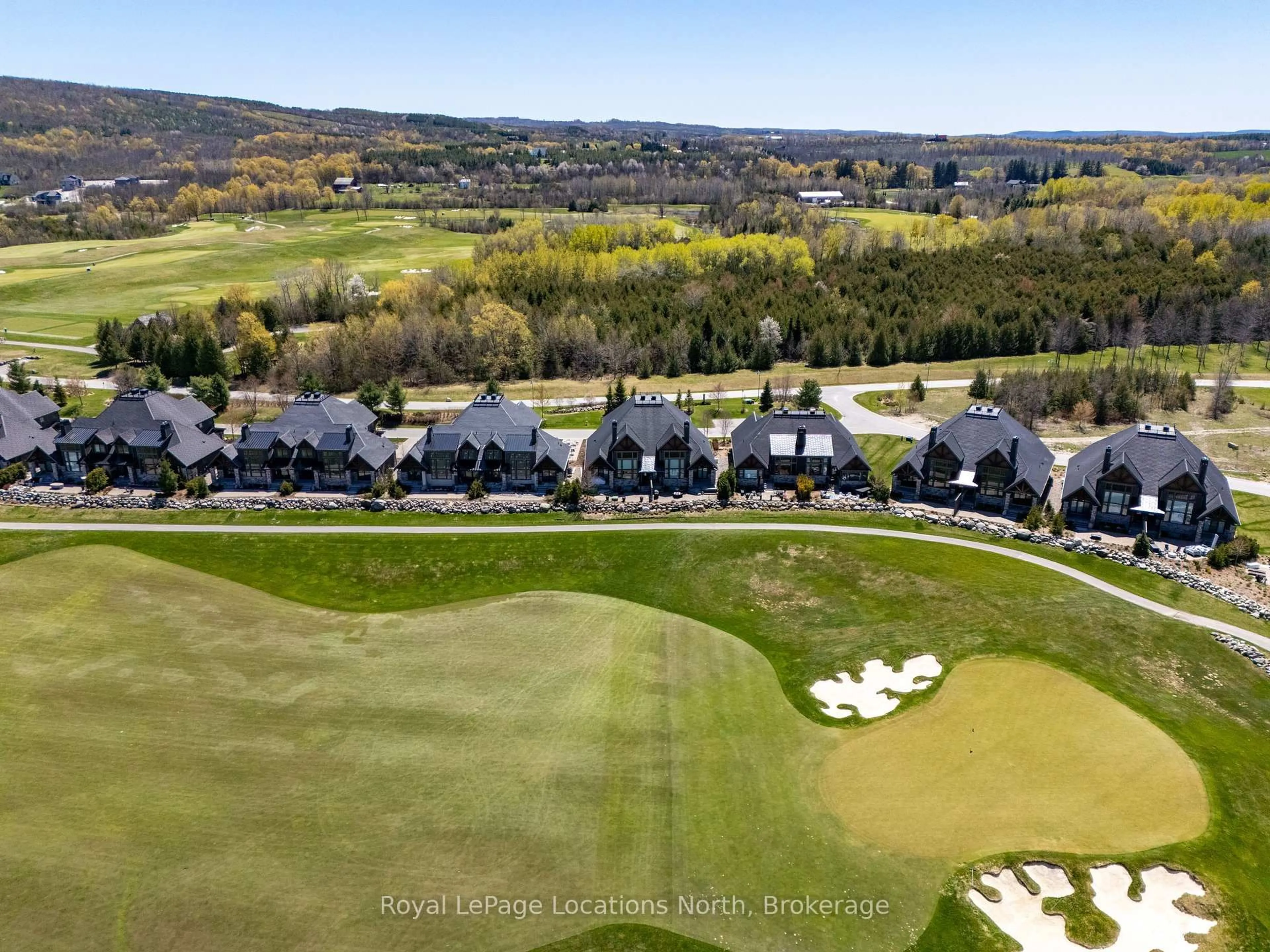 A pic from outside/outdoor area/front of a property/back of a property/a pic from drone, water/lake/river/ocean view for 129 Georgian Bay Lane, Blue Mountains Ontario N0H 1J0