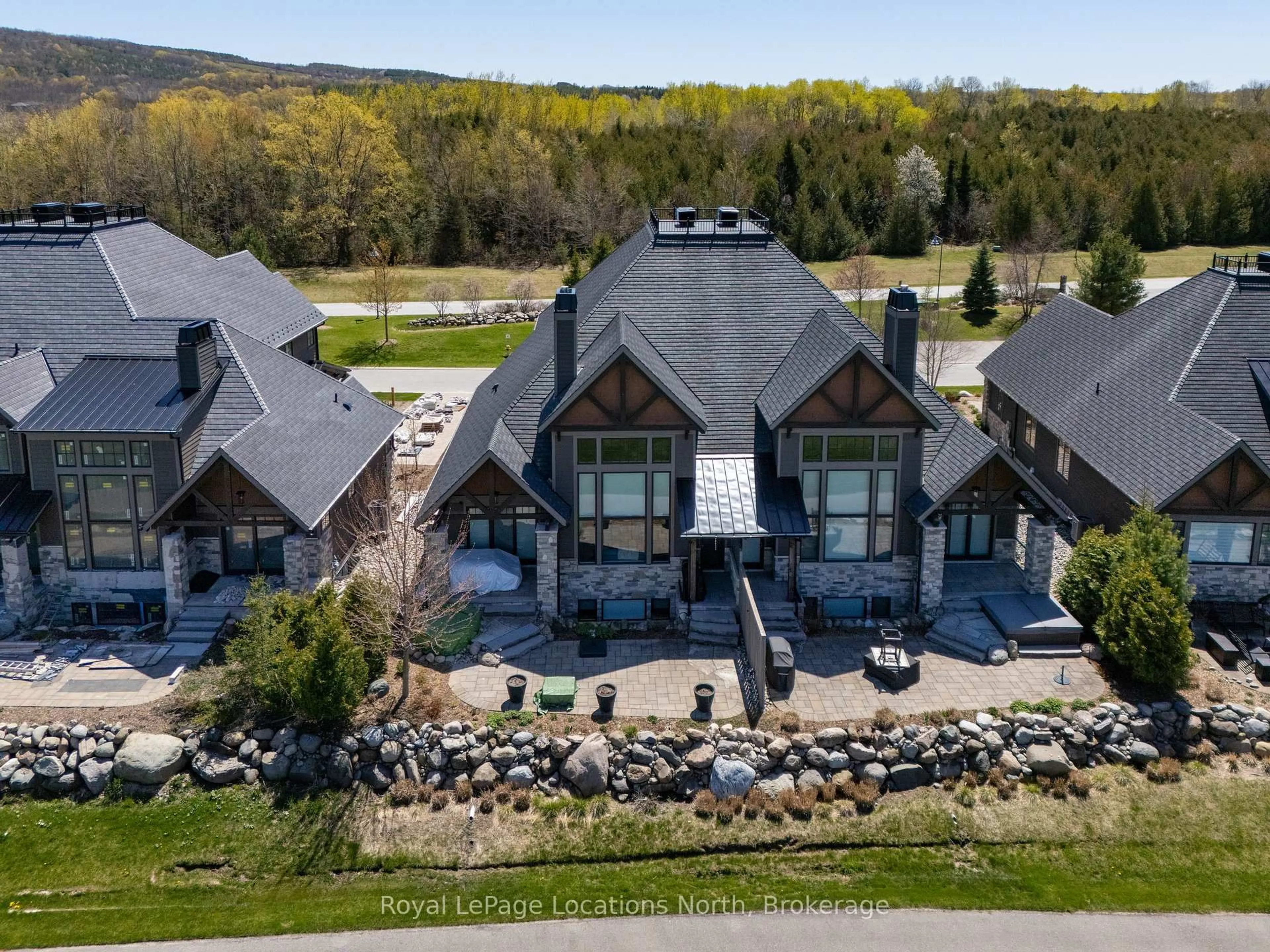 A pic from outside/outdoor area/front of a property/back of a property/a pic from drone, mountain view for 129 Georgian Bay Lane, Blue Mountains Ontario N0H 1J0