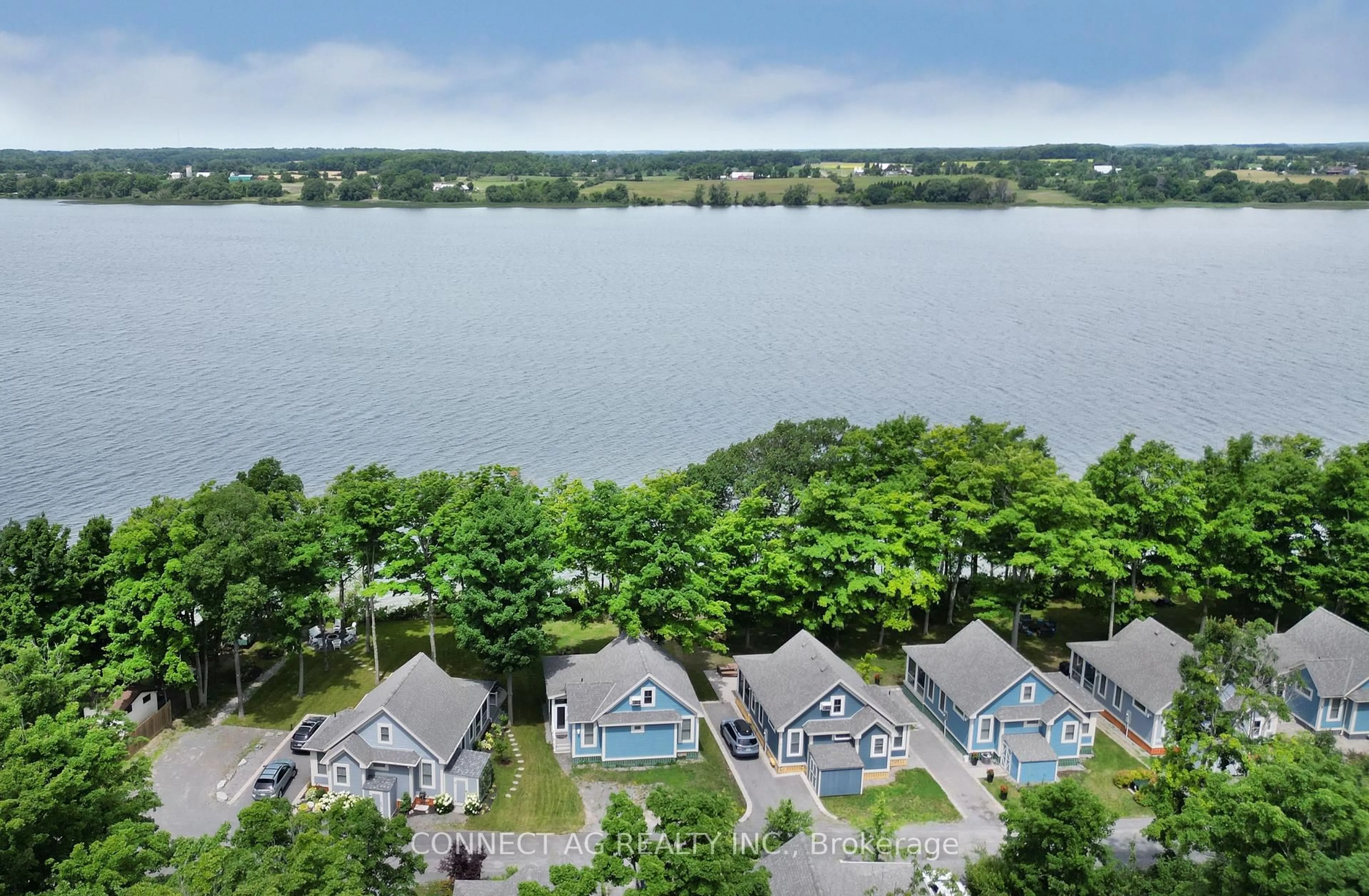 A pic from outside/outdoor area/front of a property/back of a property/a pic from drone, water/lake/river/ocean view for 44 Summer Village Lane #236, Prince Edward County Ontario K0K 1P0