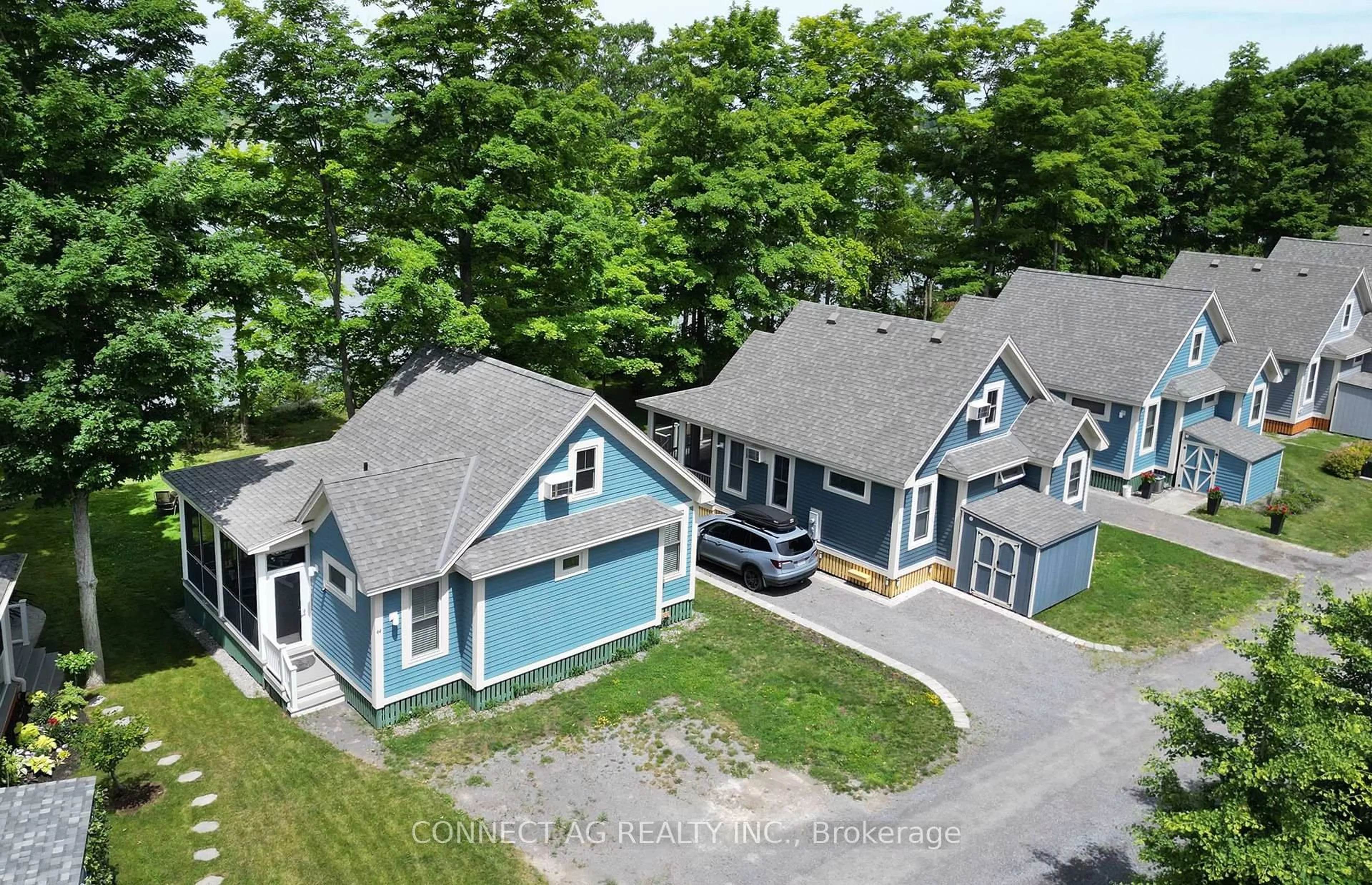 A pic from outside/outdoor area/front of a property/back of a property/a pic from drone, street for 44 Summer Village Lane #236, Prince Edward County Ontario K0K 1P0