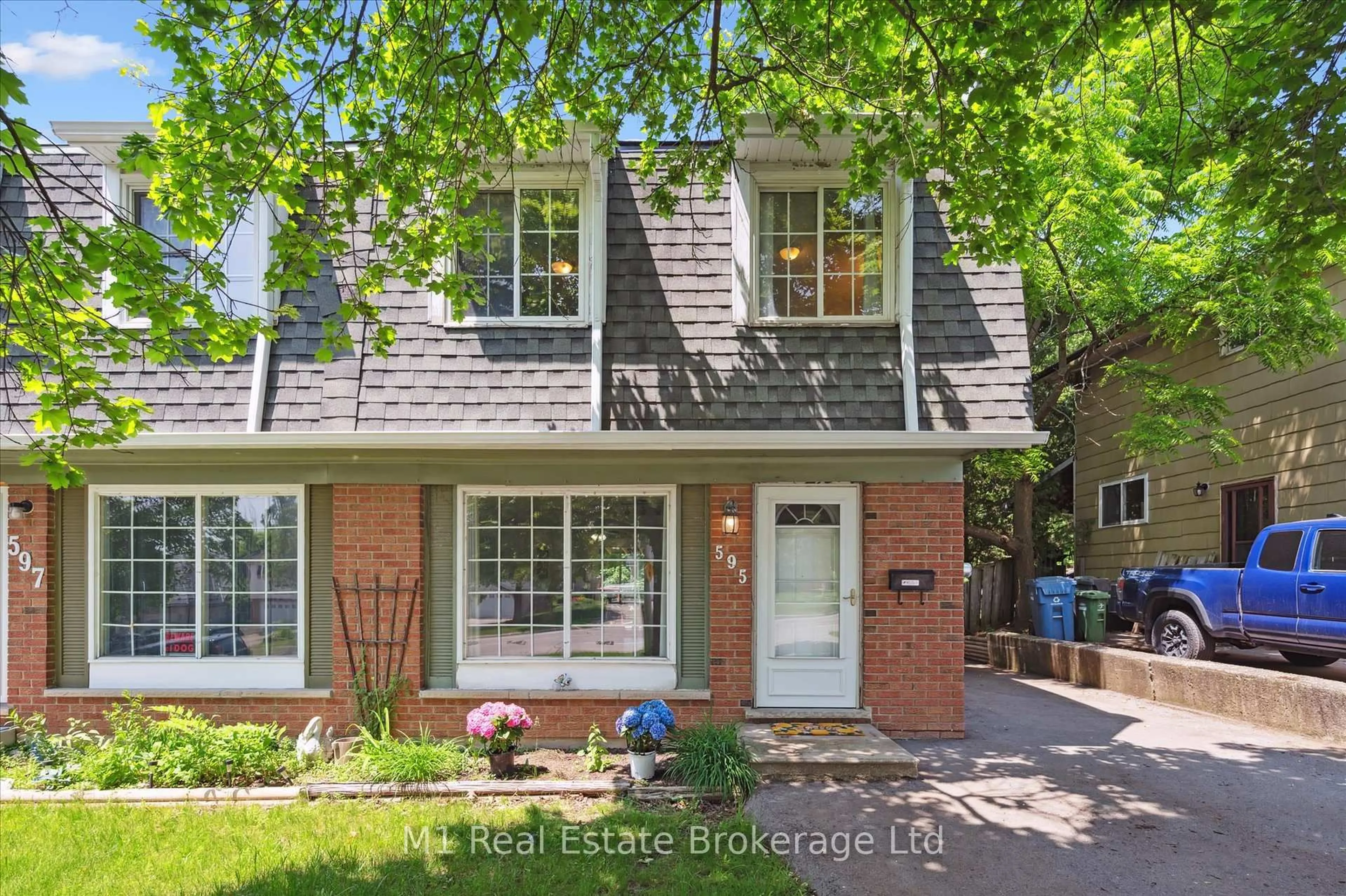 Home with brick exterior material, street for 595 Willow Rd, Guelph Ontario N1H 7J8