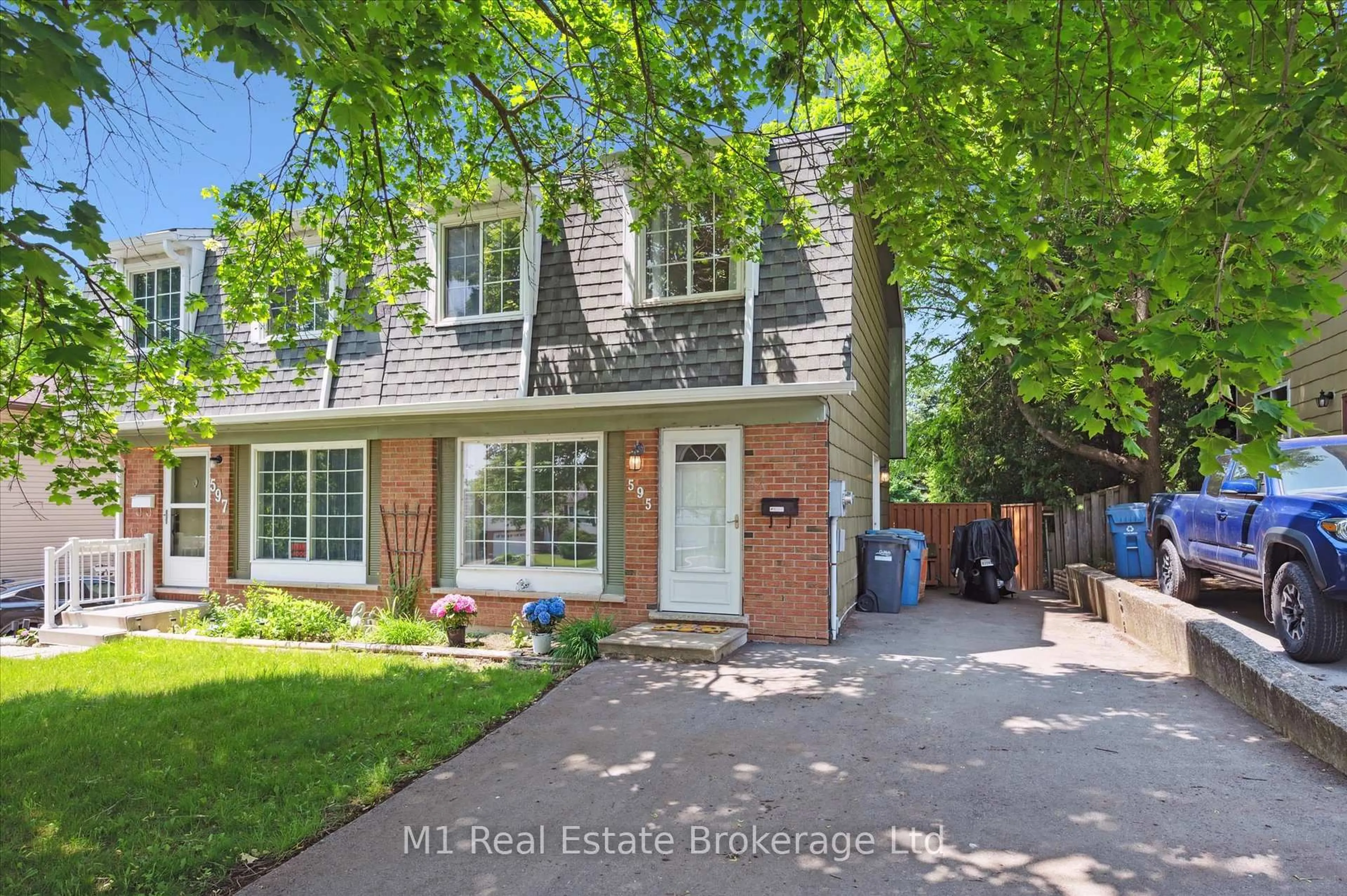 Home with brick exterior material, street for 595 Willow Rd, Guelph Ontario N1H 7J8
