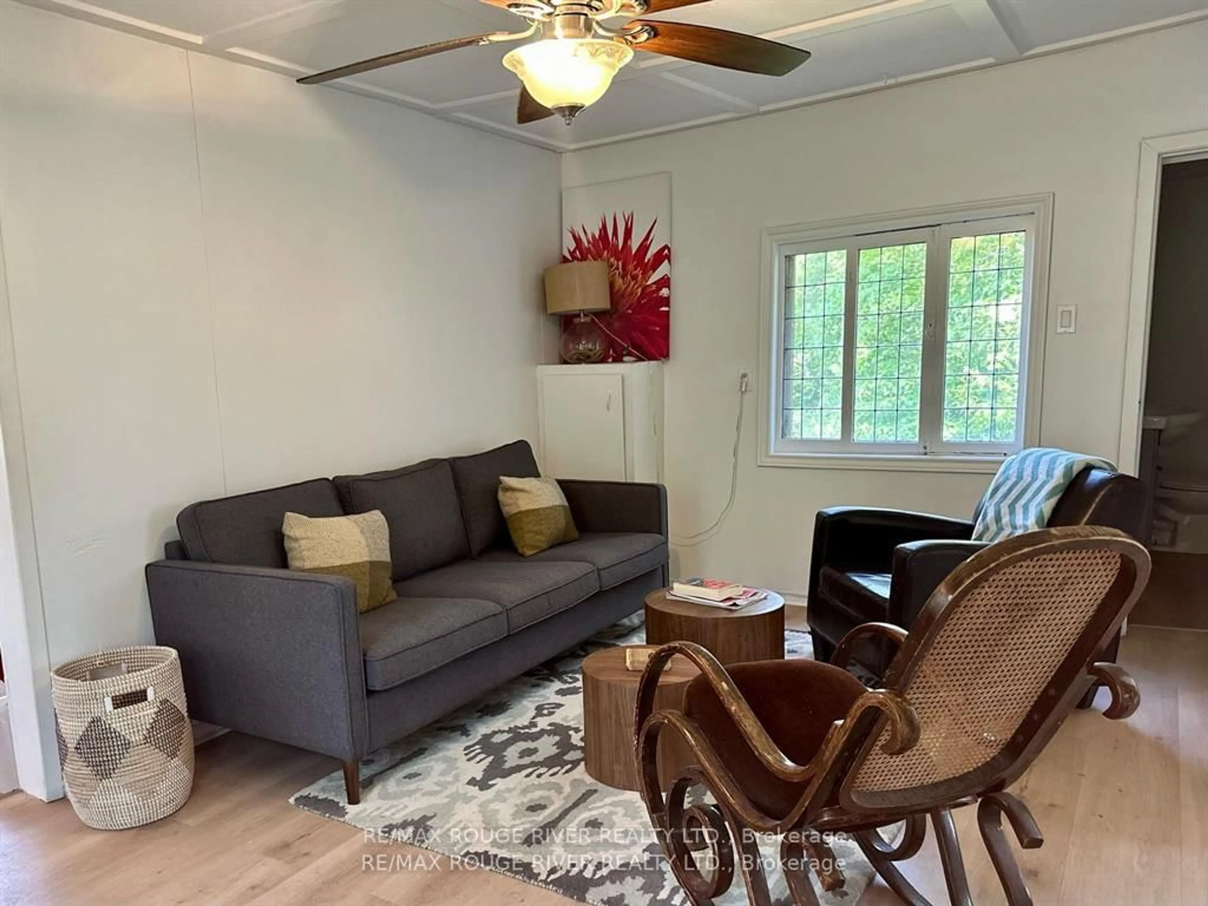 Living room with furniture, wood/laminate floor for 247 Dunnette Landing Rd ##1, Alnwick/Haldimand Ontario K0K 2X0