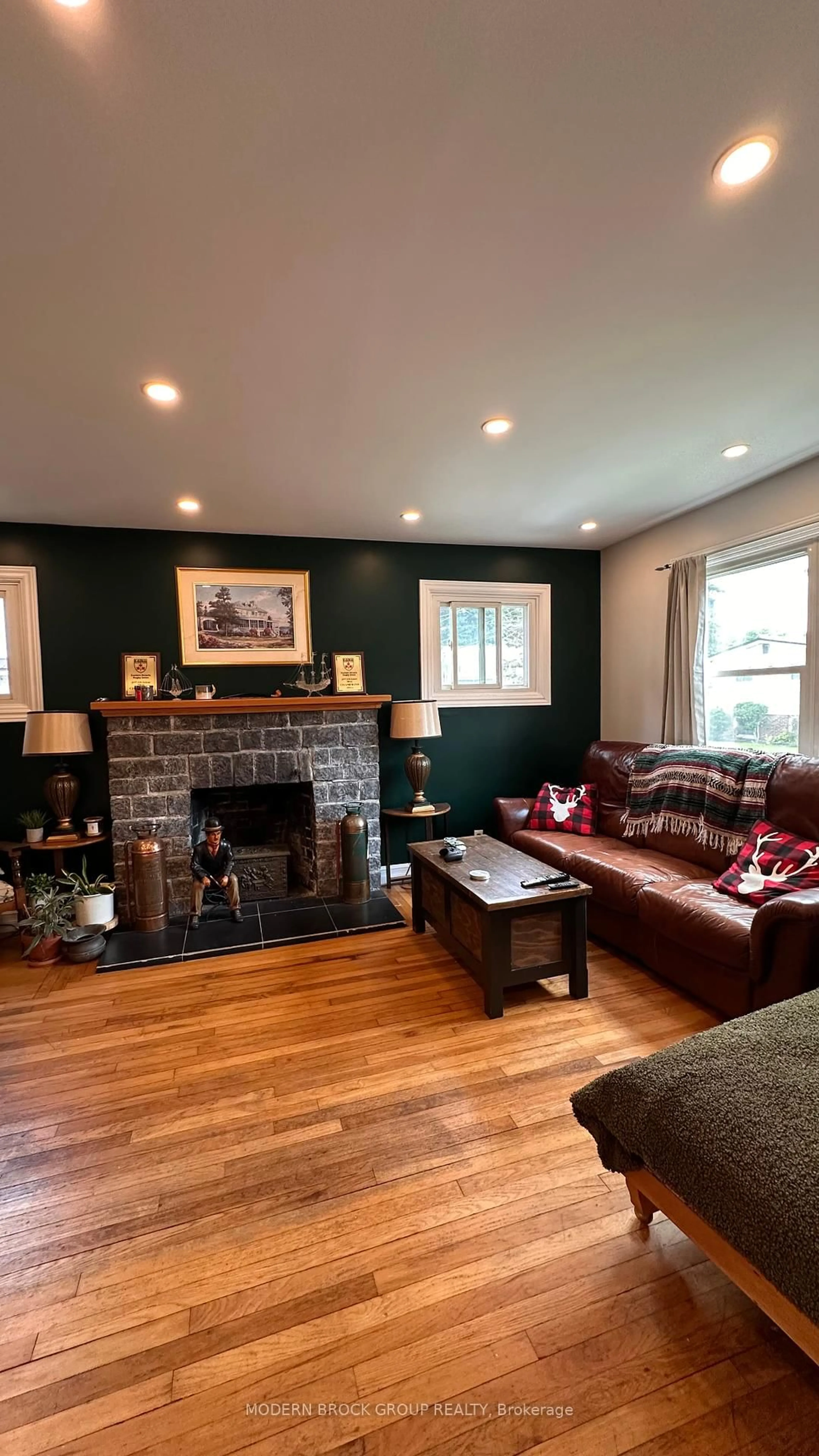 Living room with furniture, wood/laminate floor for 22 Mccready St, Brockville Ontario K6V 5N3