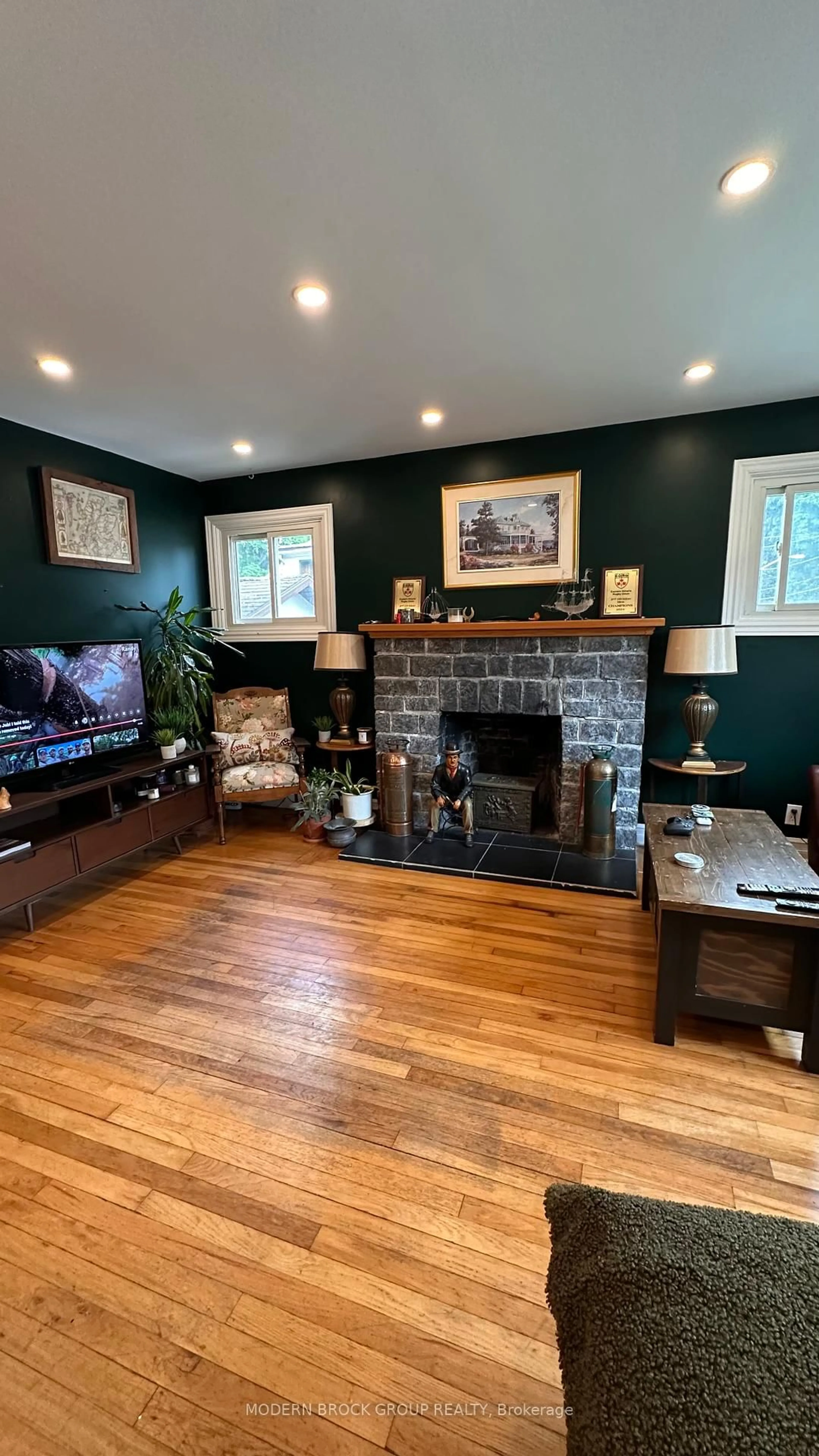 Living room with furniture, wood/laminate floor for 22 Mccready St, Brockville Ontario K6V 5N3