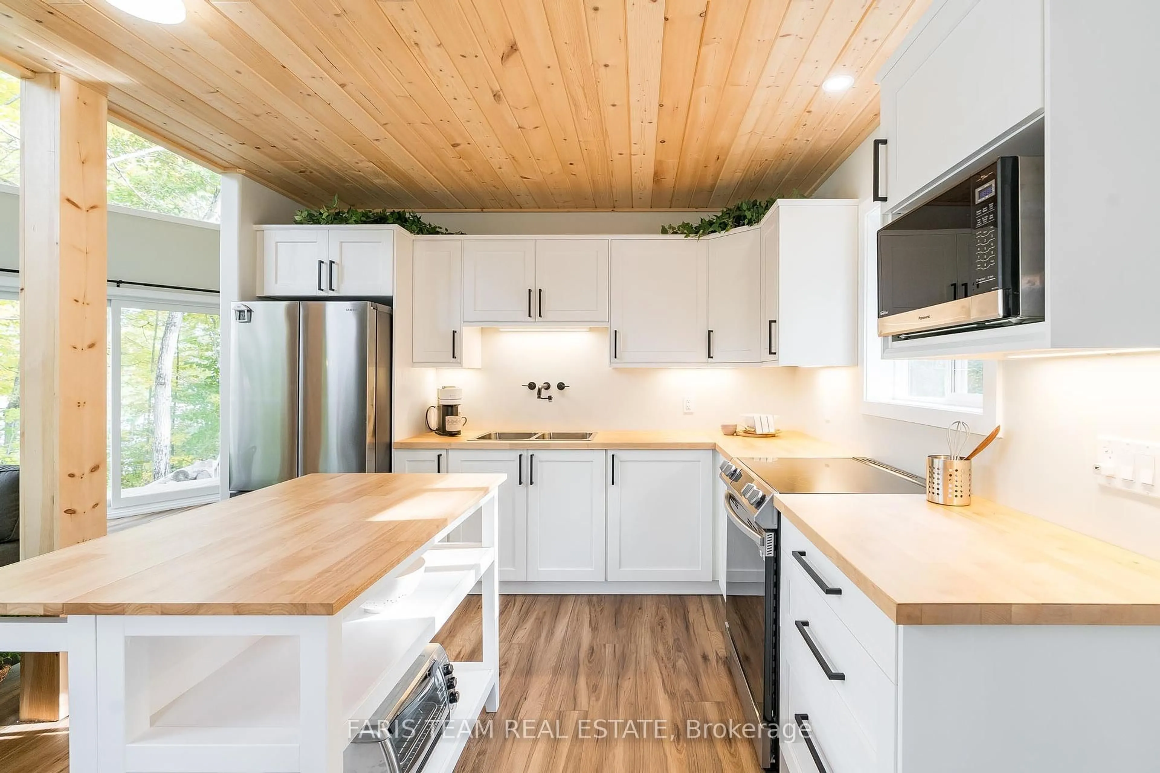 Contemporary kitchen, wood/laminate floor for 9316 Georgian Bay Shore, Georgian Bay Ontario P0E 1E0