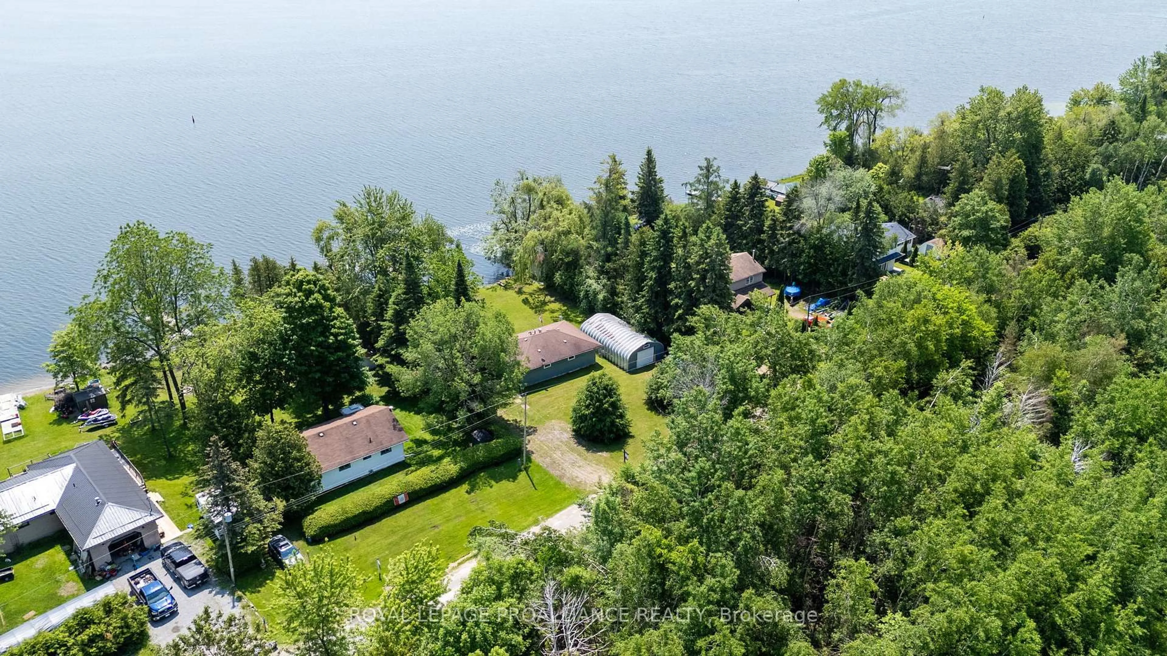 A pic from outside/outdoor area/front of a property/back of a property/a pic from drone, water/lake/river/ocean view for 70 Beach Rd, Kawartha Lakes Ontario K0M 2C0