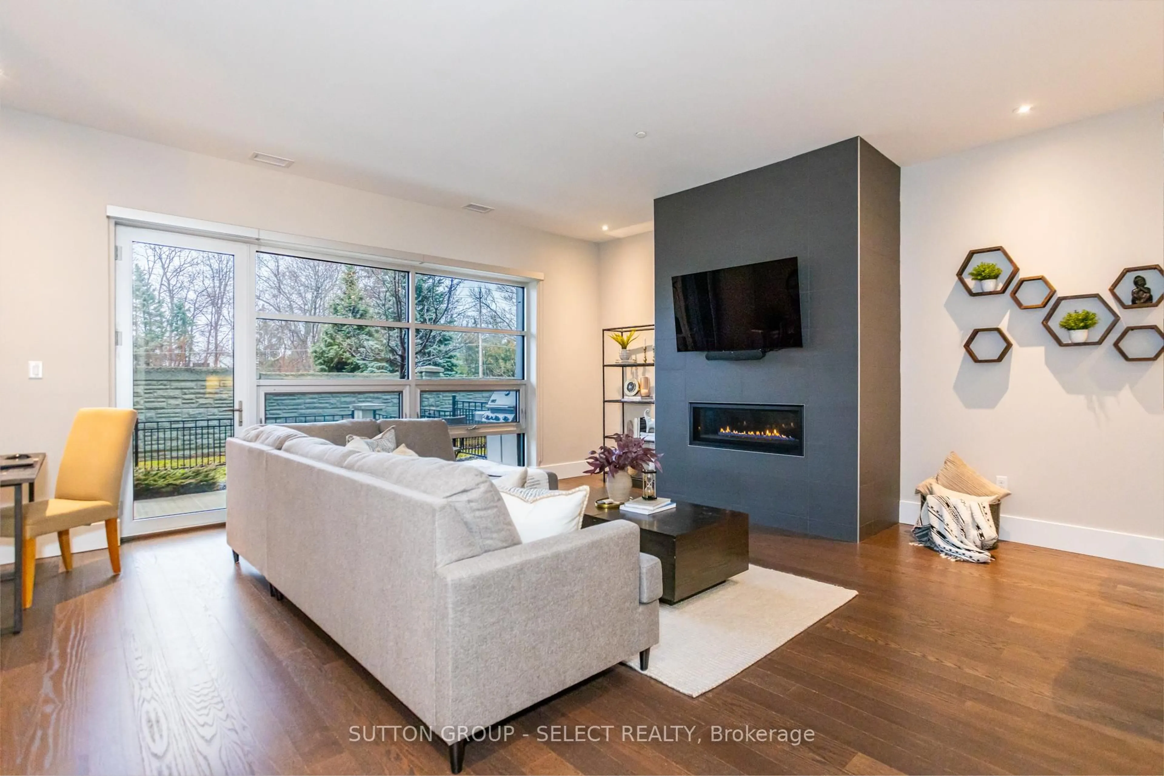 Living room with furniture, wood/laminate floor for 1705 FIDDLEHEAD Pl #100, London North Ontario N6G 5M9