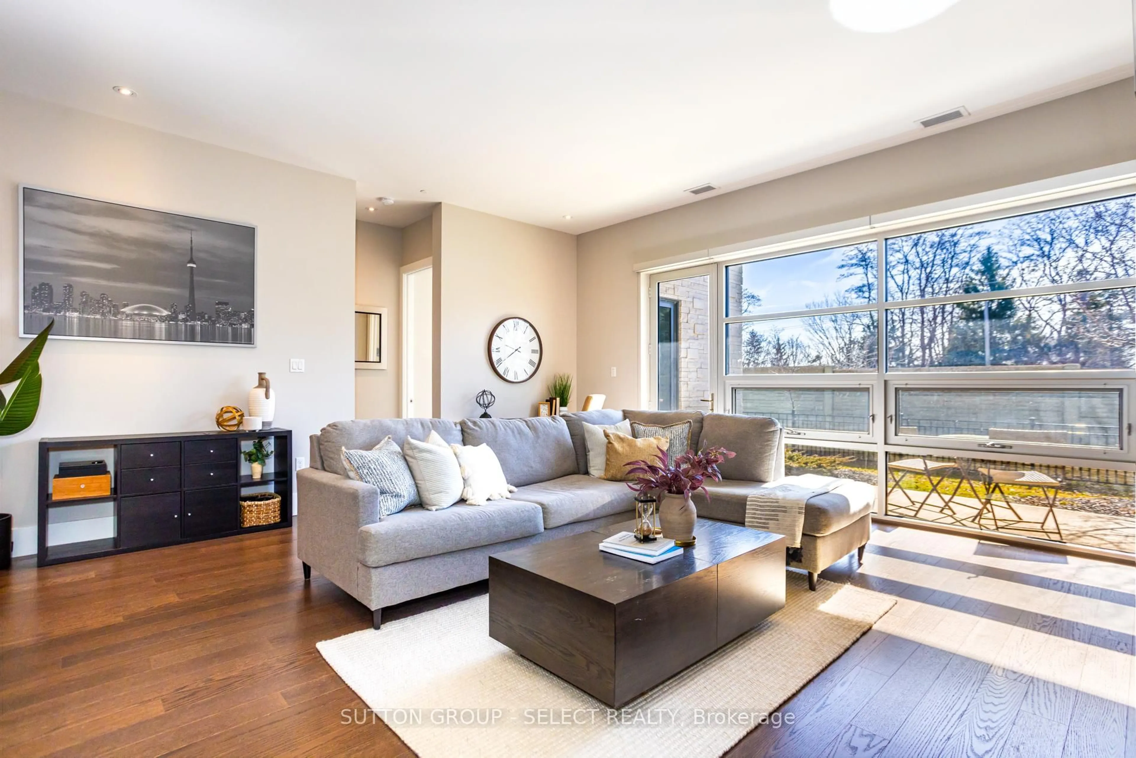 Living room with furniture, wood/laminate floor for 1705 FIDDLEHEAD Pl #100, London North Ontario N6G 5M9