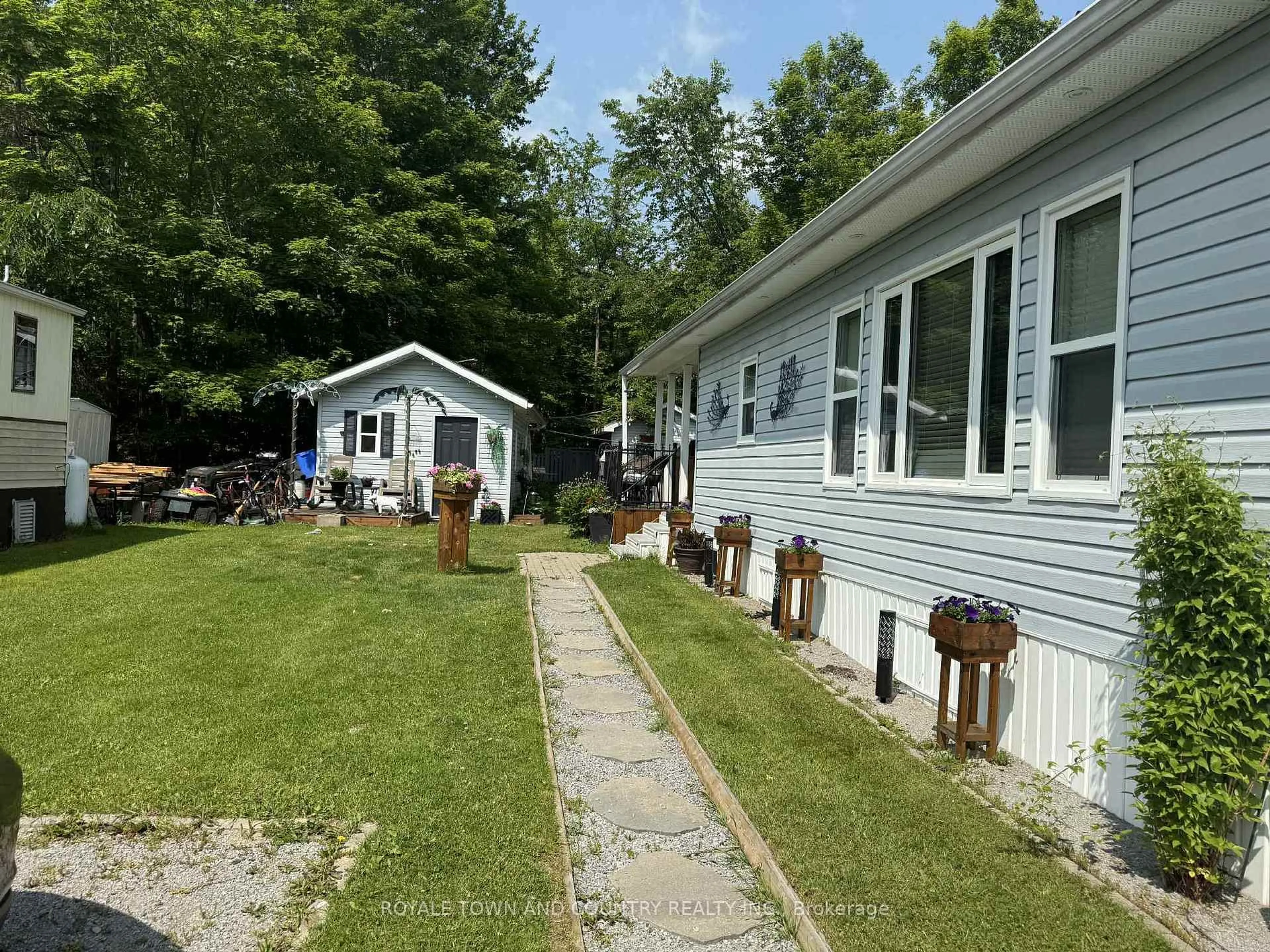 A pic from outside/outdoor area/front of a property/back of a property/a pic from drone, water/lake/river/ocean view for 1802 County Road 121 #315, Kawartha Lakes Ontario K0M 1N0