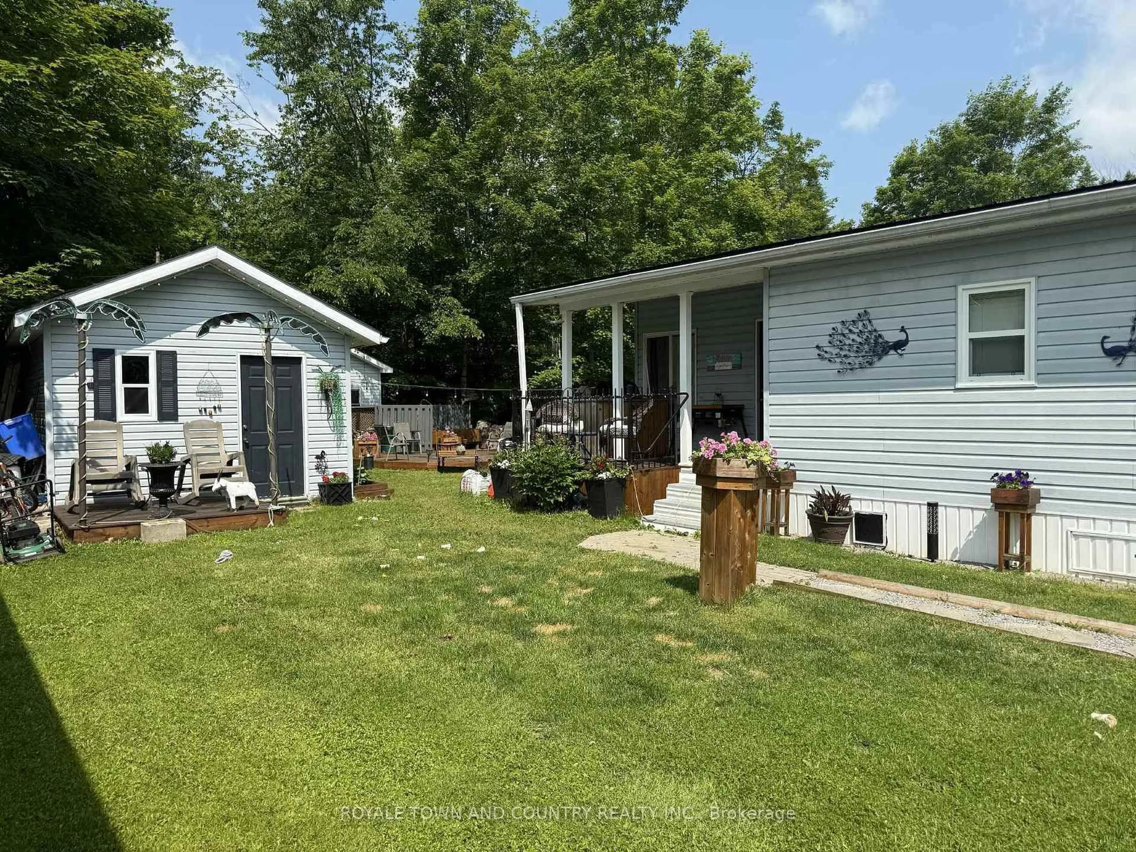 A pic from outside/outdoor area/front of a property/back of a property/a pic from drone, water/lake/river/ocean view for 1802 County Road 121 #315, Kawartha Lakes Ontario K0M 1N0