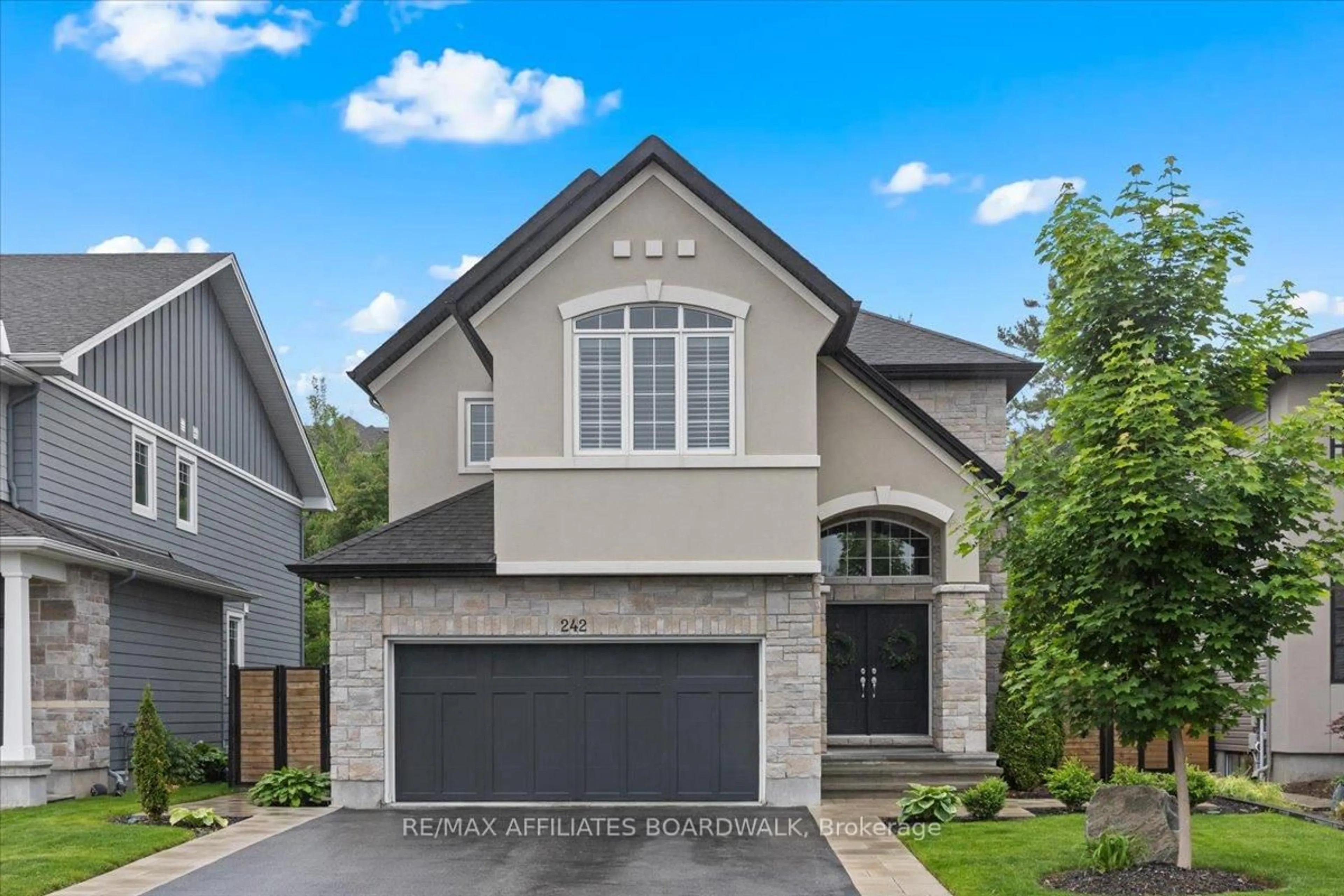 Home with brick exterior material, street for 242 Escarpment Cres, Ottawa Ontario K2T 0L6