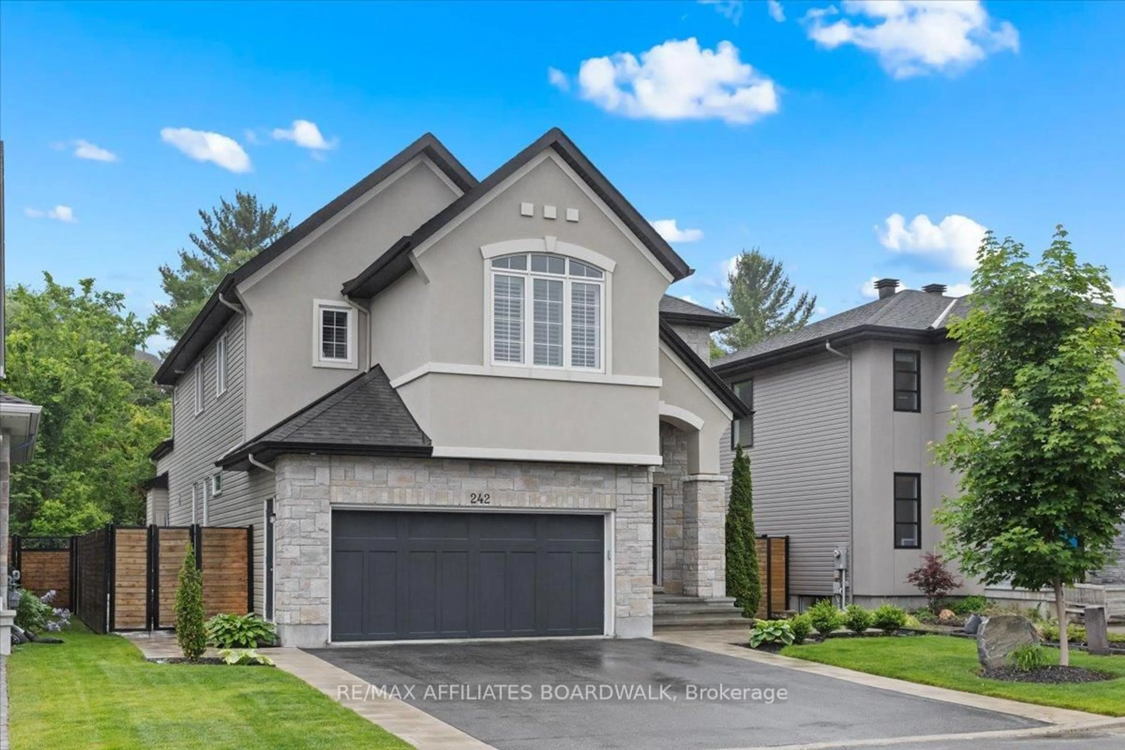 Home with brick exterior material, street for 242 Escarpment Cres, Ottawa Ontario K2T 0L6