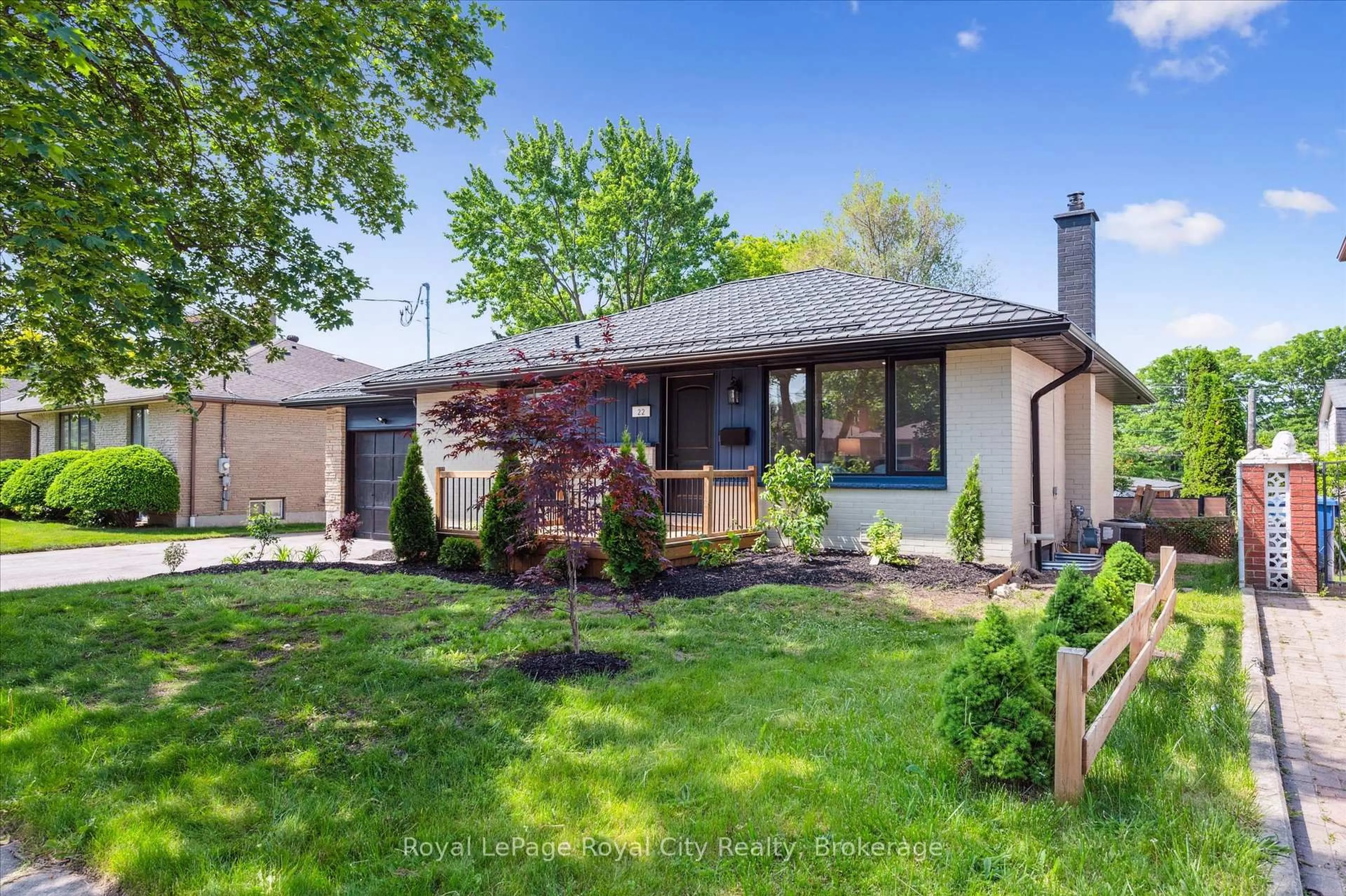 Home with brick exterior material, street for 22 Heath Rd, Guelph Ontario N1H 6G9