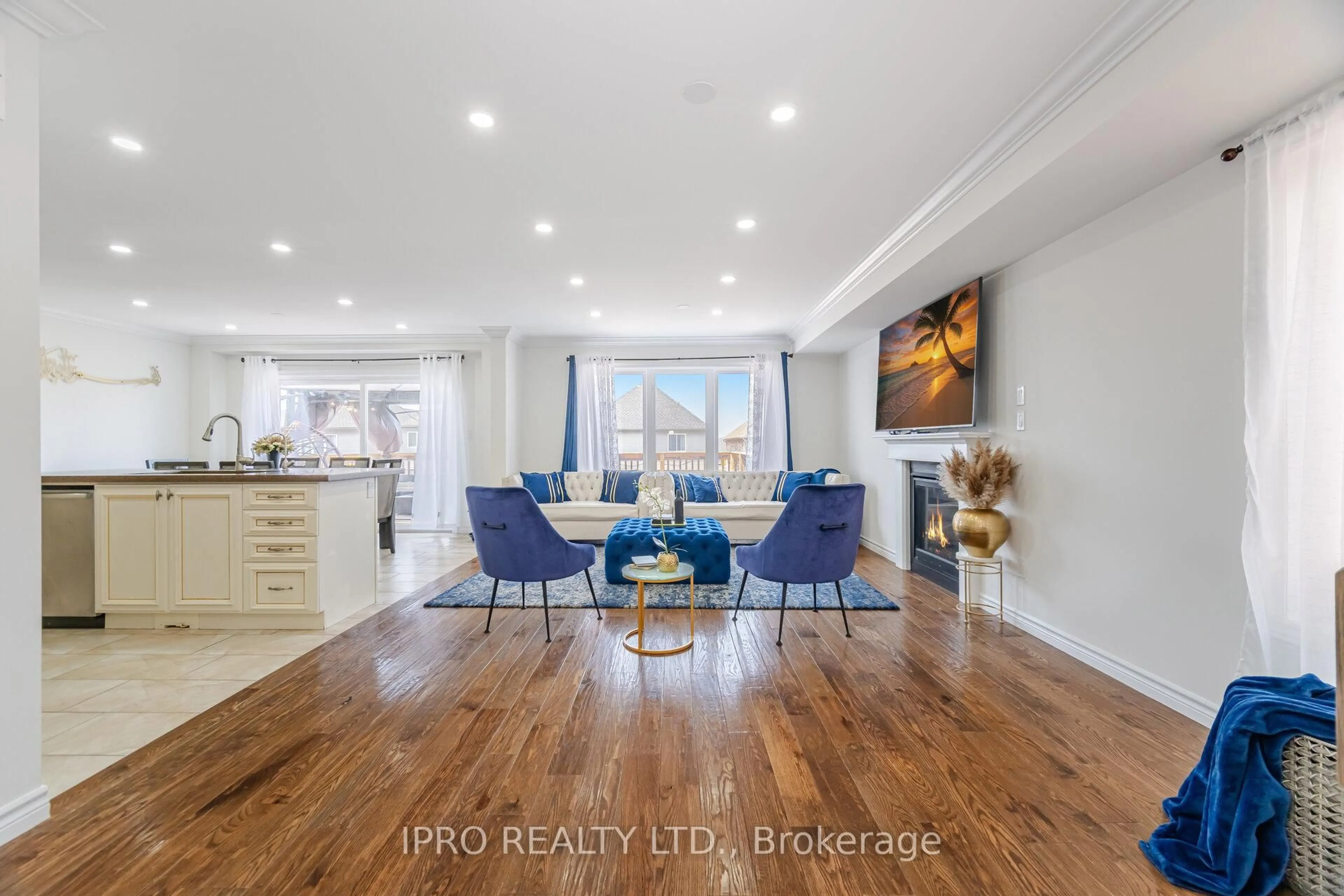 Living room with furniture, wood/laminate floor for 132 Coker Cres, Guelph/Eramosa Ontario N0B 2K0