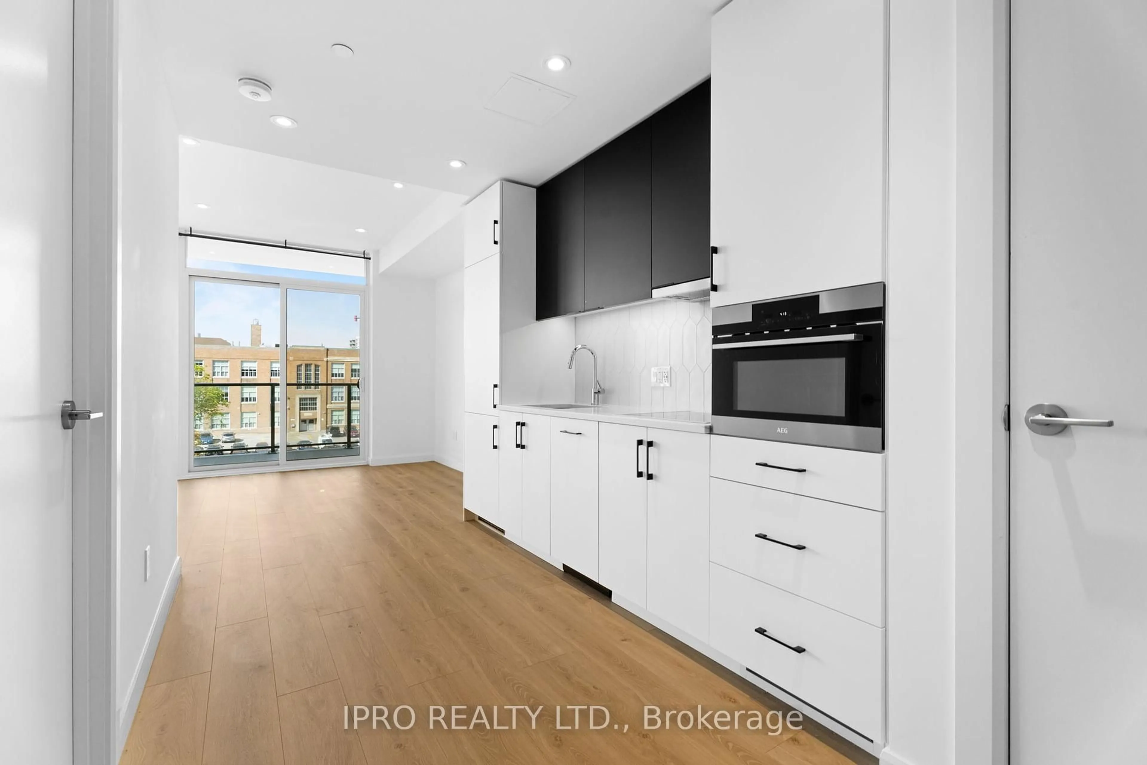 Open concept kitchen, wood/laminate floor for 741 King St #509, Kitchener Ontario N2G 0E9