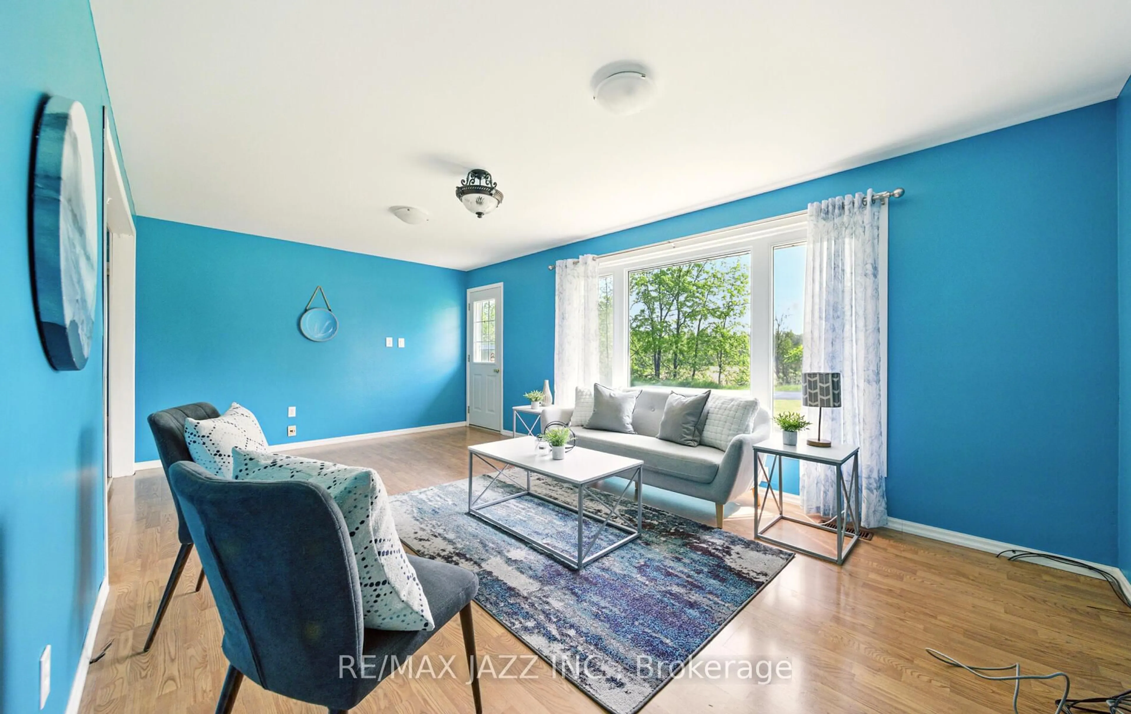Living room with furniture, wood/laminate floor for 8106 Tinkerville Rd, Port Hope Ontario L0A 1B0