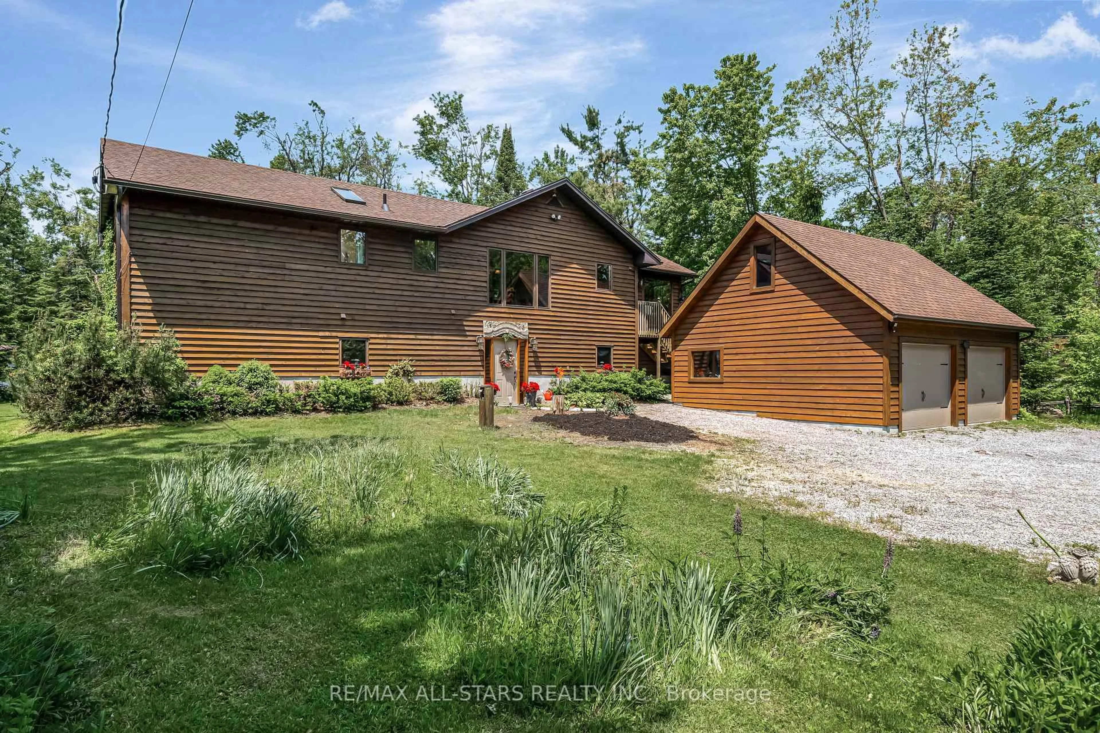 A pic from outside/outdoor area/front of a property/back of a property/a pic from drone, water/lake/river/ocean view for 98 Edwina Dr, Trent Lakes Ontario K0M 1A0