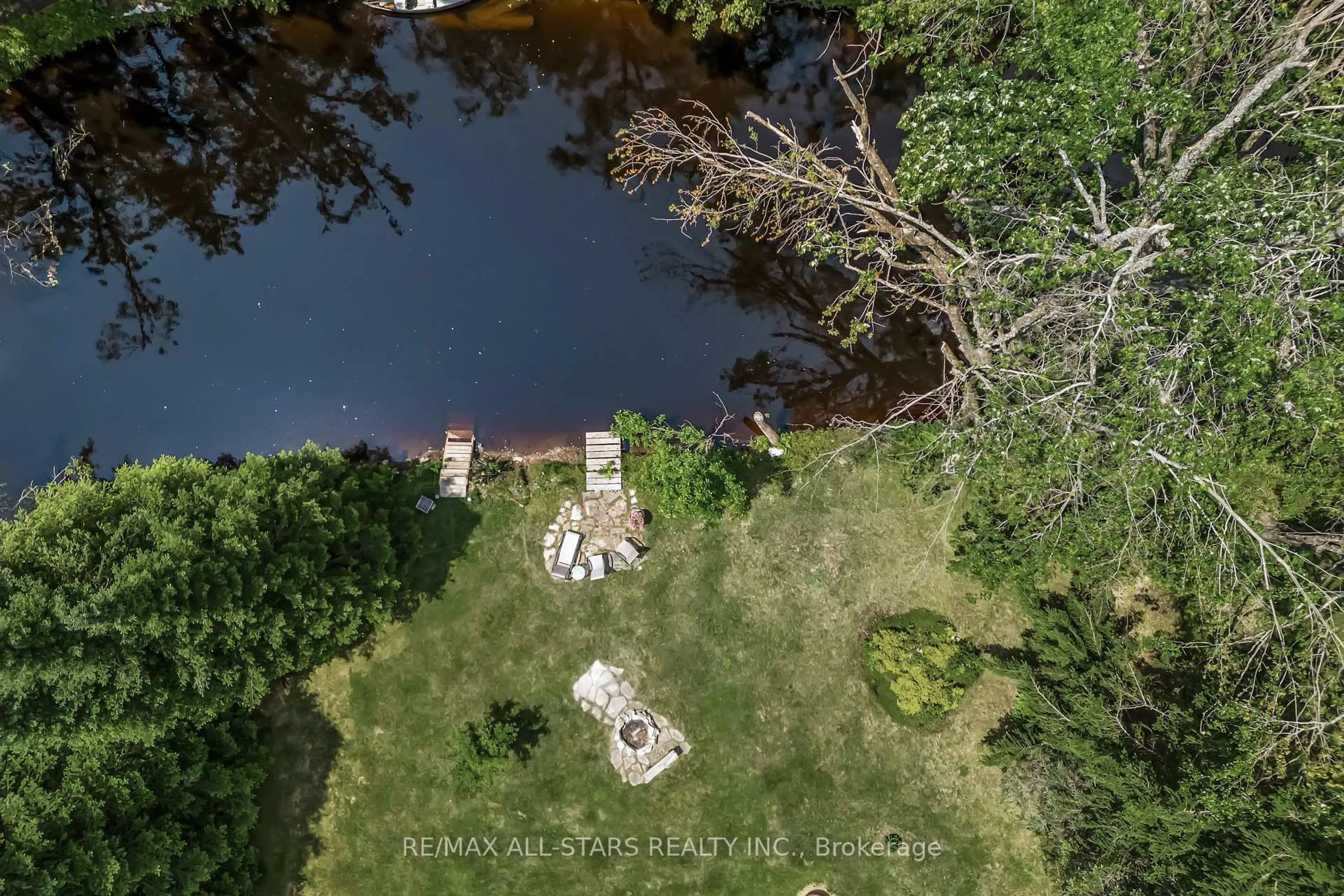 A pic from outside/outdoor area/front of a property/back of a property/a pic from drone, water/lake/river/ocean view for 98 Edwina Dr, Trent Lakes Ontario K0M 1A0