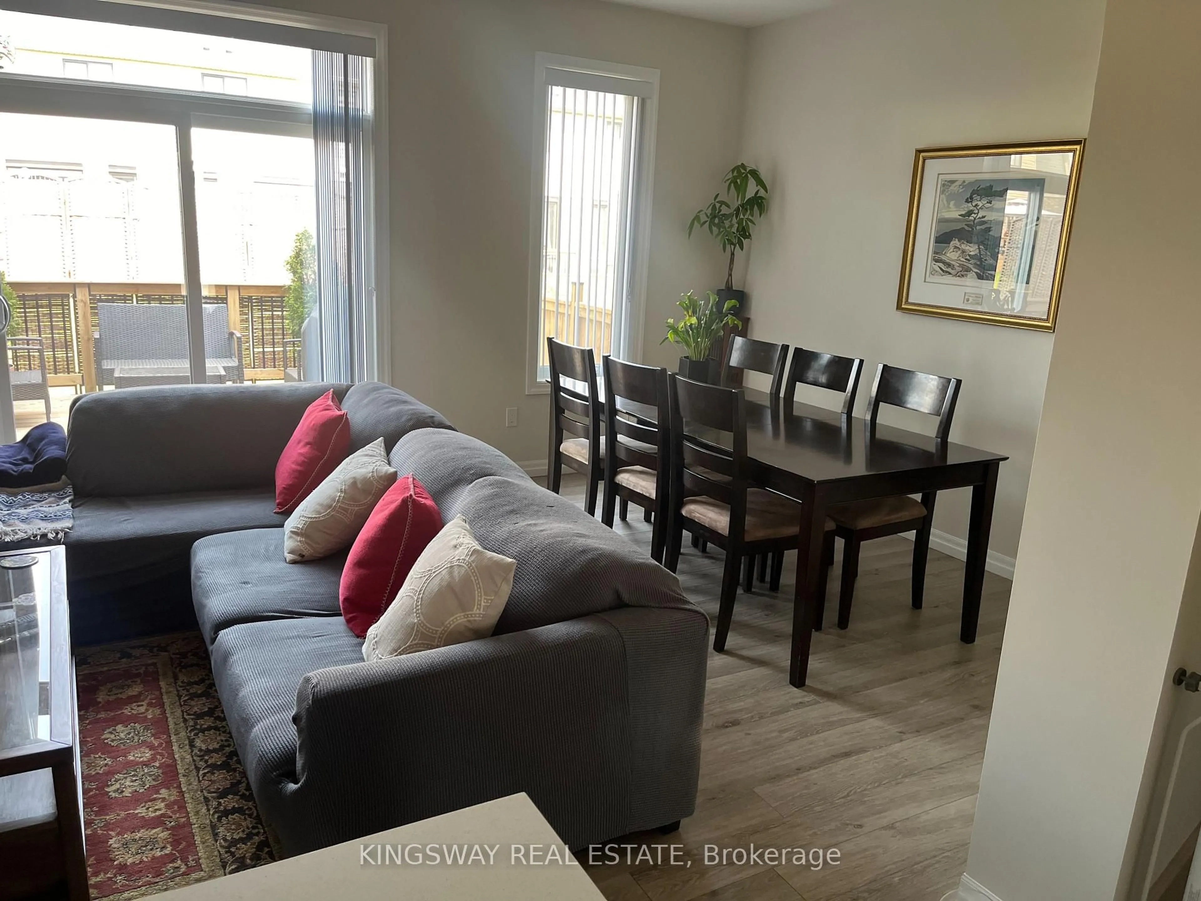 Living room with furniture, wood/laminate floor for 83 Keba Cres, Tillsonburg Ontario N4G 0K7