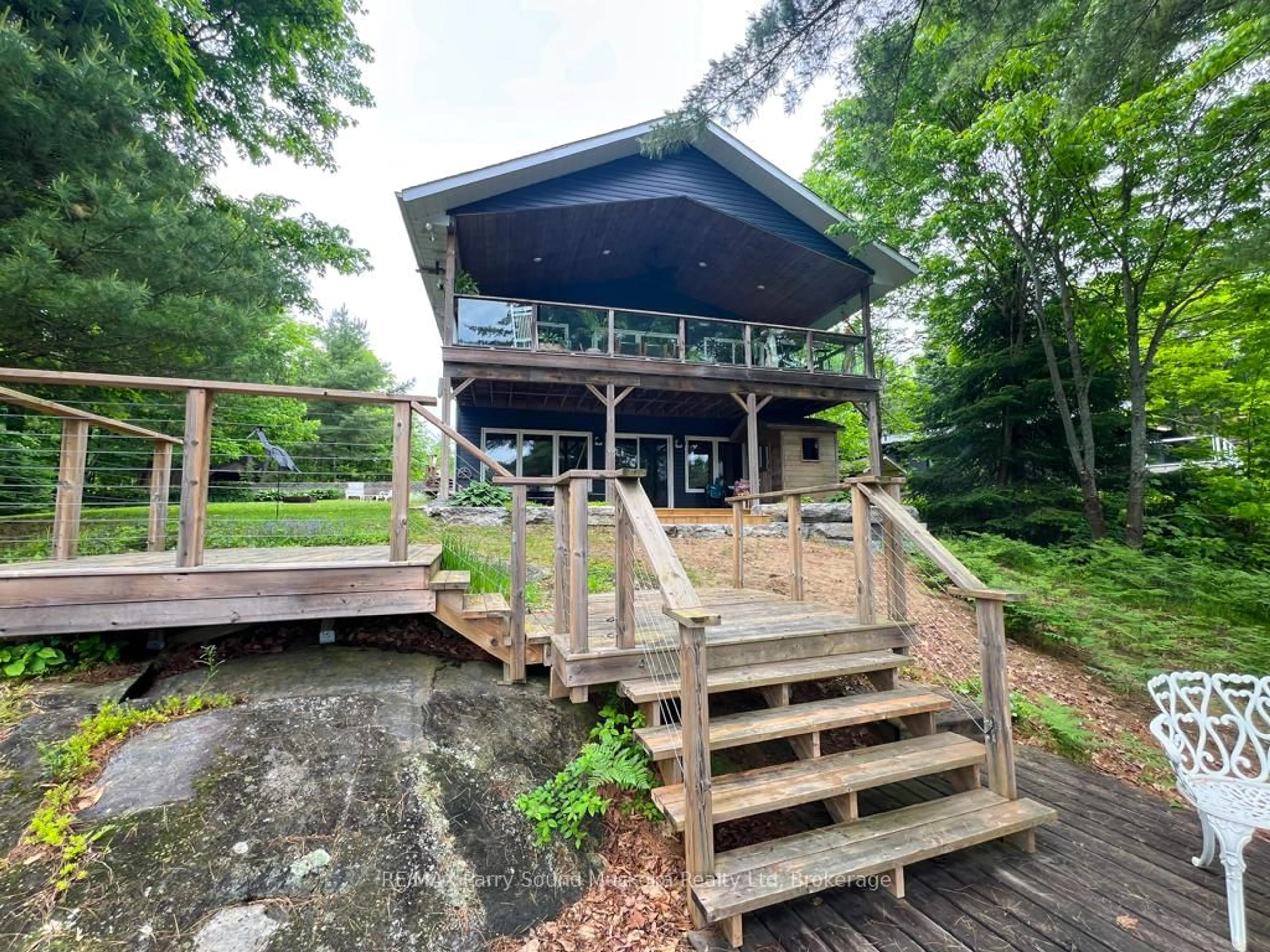 A pic from outside/outdoor area/front of a property/back of a property/a pic from drone, water/lake/river/ocean view for 45 Peninsula Shores Rd, McDougall Ontario P2A 2W7