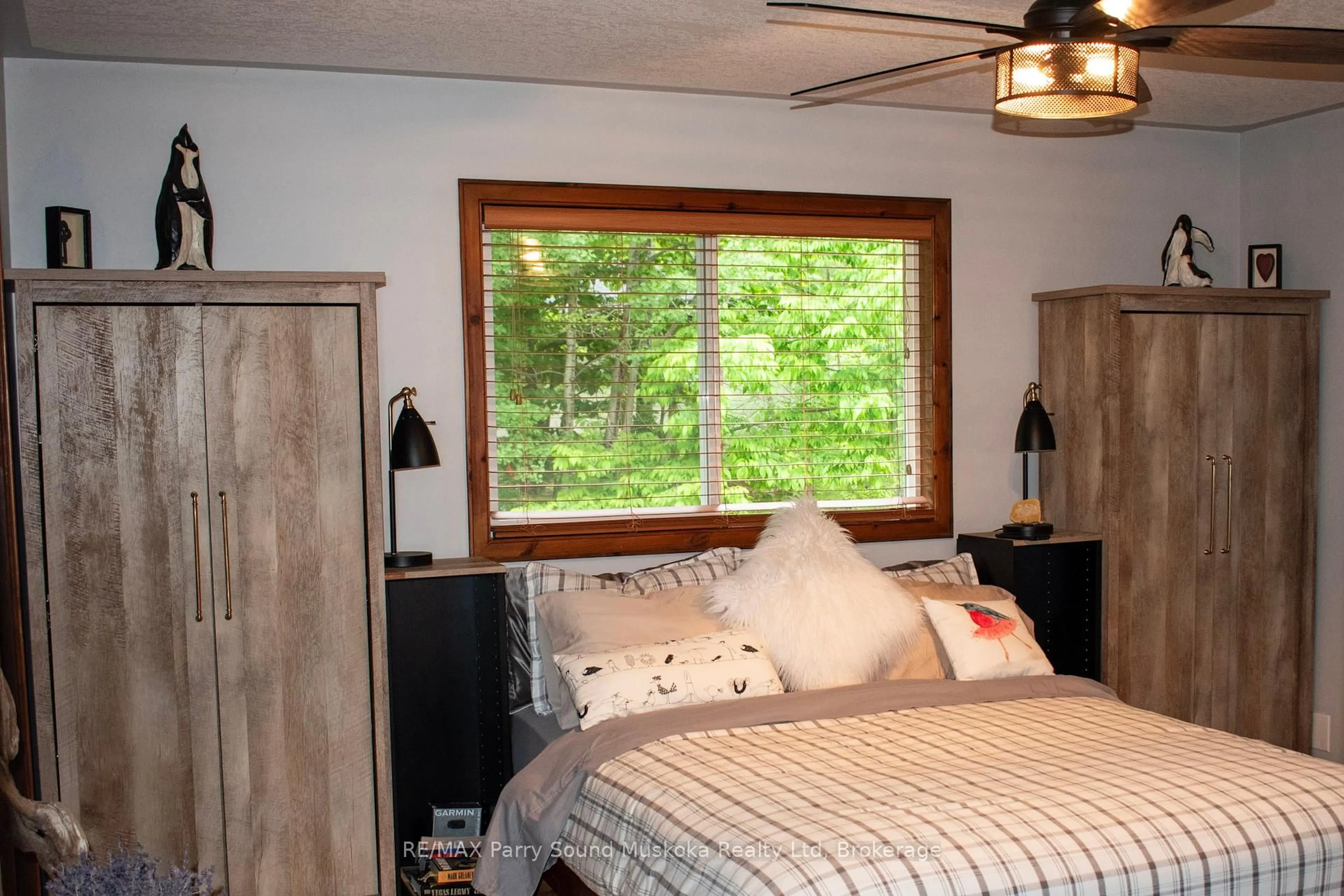 Bedroom with bed, wood/laminate floor for 45 Peninsula Shores Rd, McDougall Ontario P2A 2W7