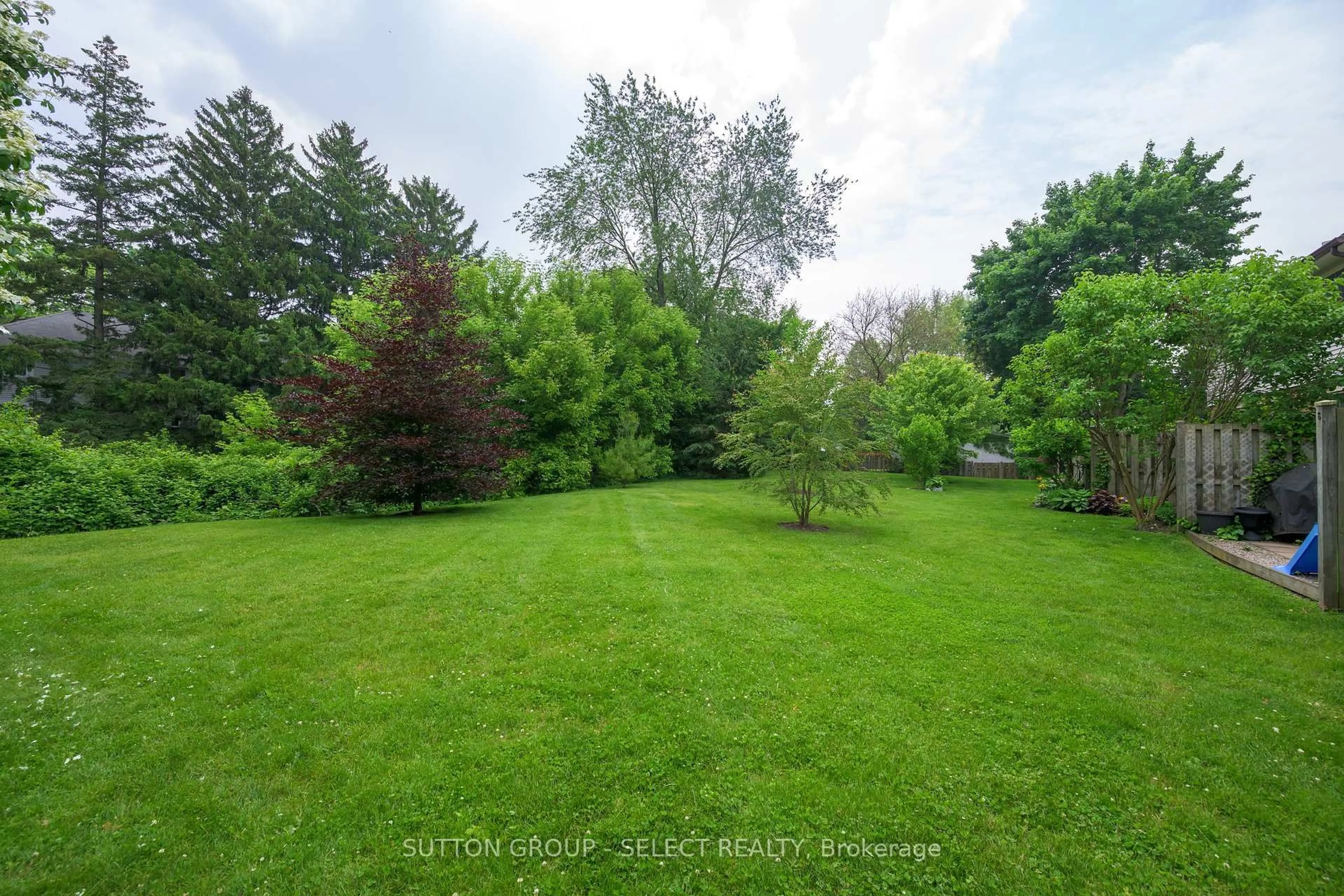 A pic from outside/outdoor area/front of a property/back of a property/a pic from drone, forest/trees view for 1328 Commissioners Rd #102, London South Ontario N6K 2Y6