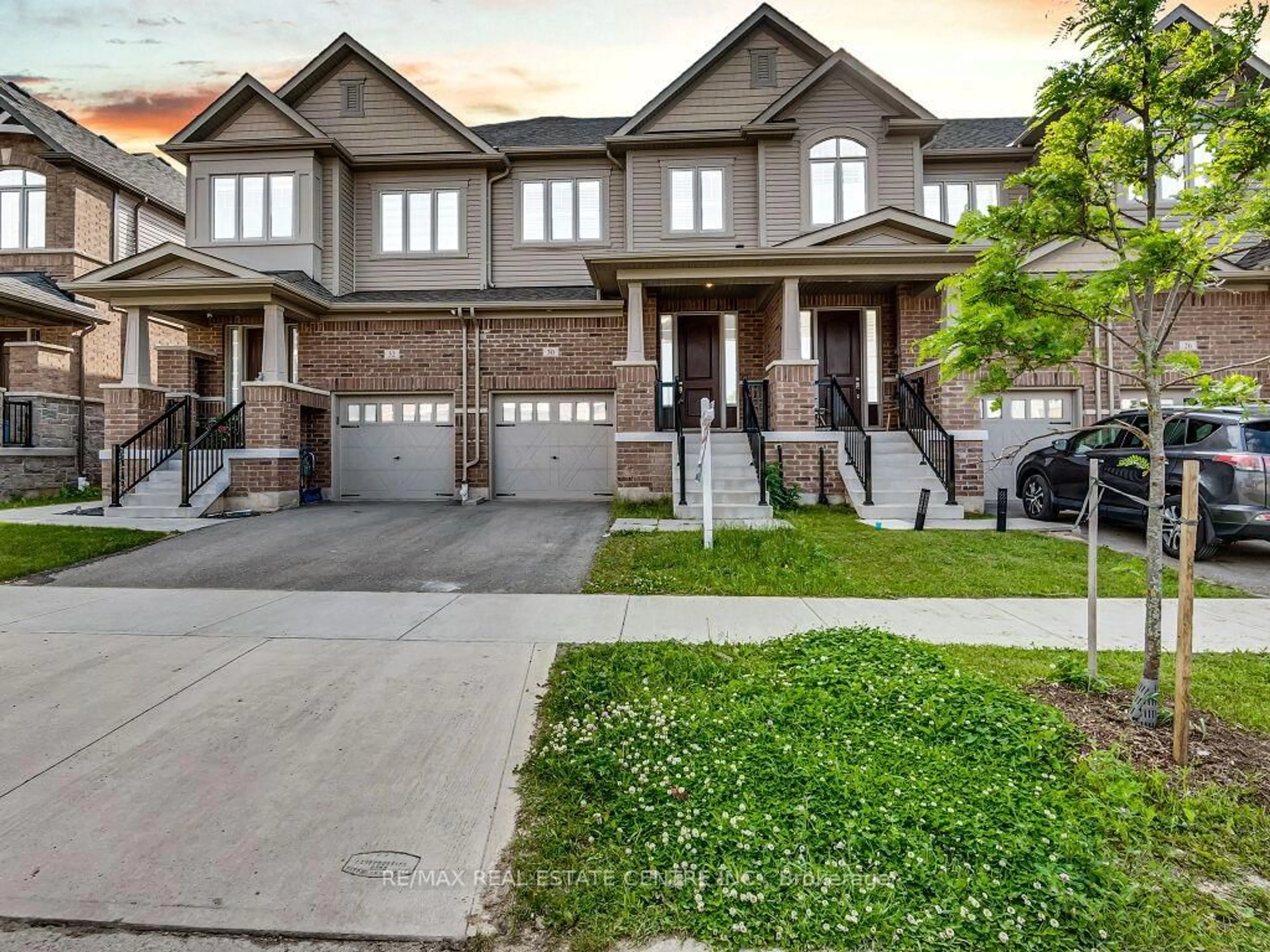 Home with brick exterior material, street for 30 Grassbourne Ave, Kitchener Ontario N2R 0R1