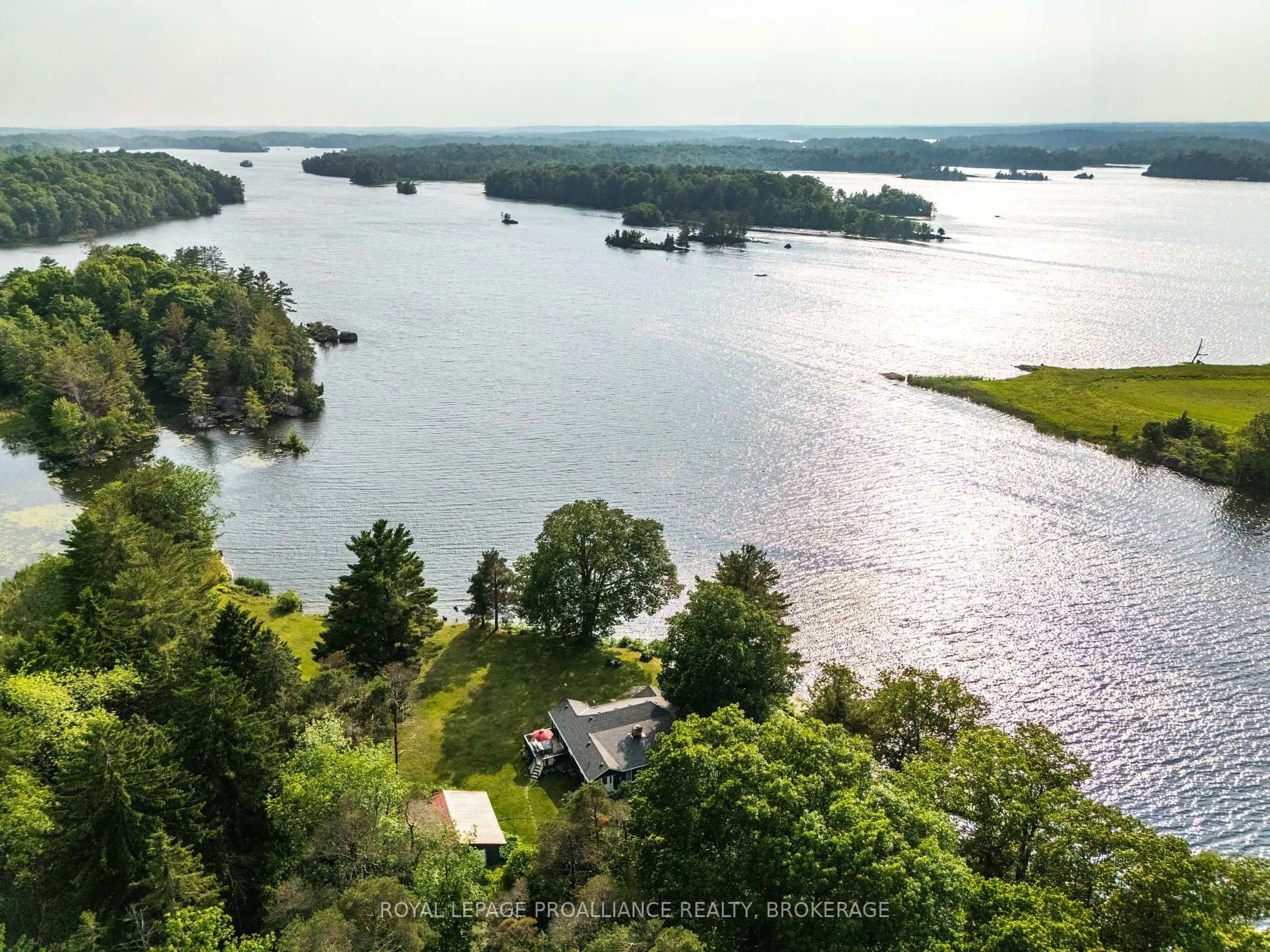 A pic from outside/outdoor area/front of a property/back of a property/a pic from drone, water/lake/river/ocean view for 4788 Leo Lake Rd, Seeley's Bay Ontario K0H 2N0