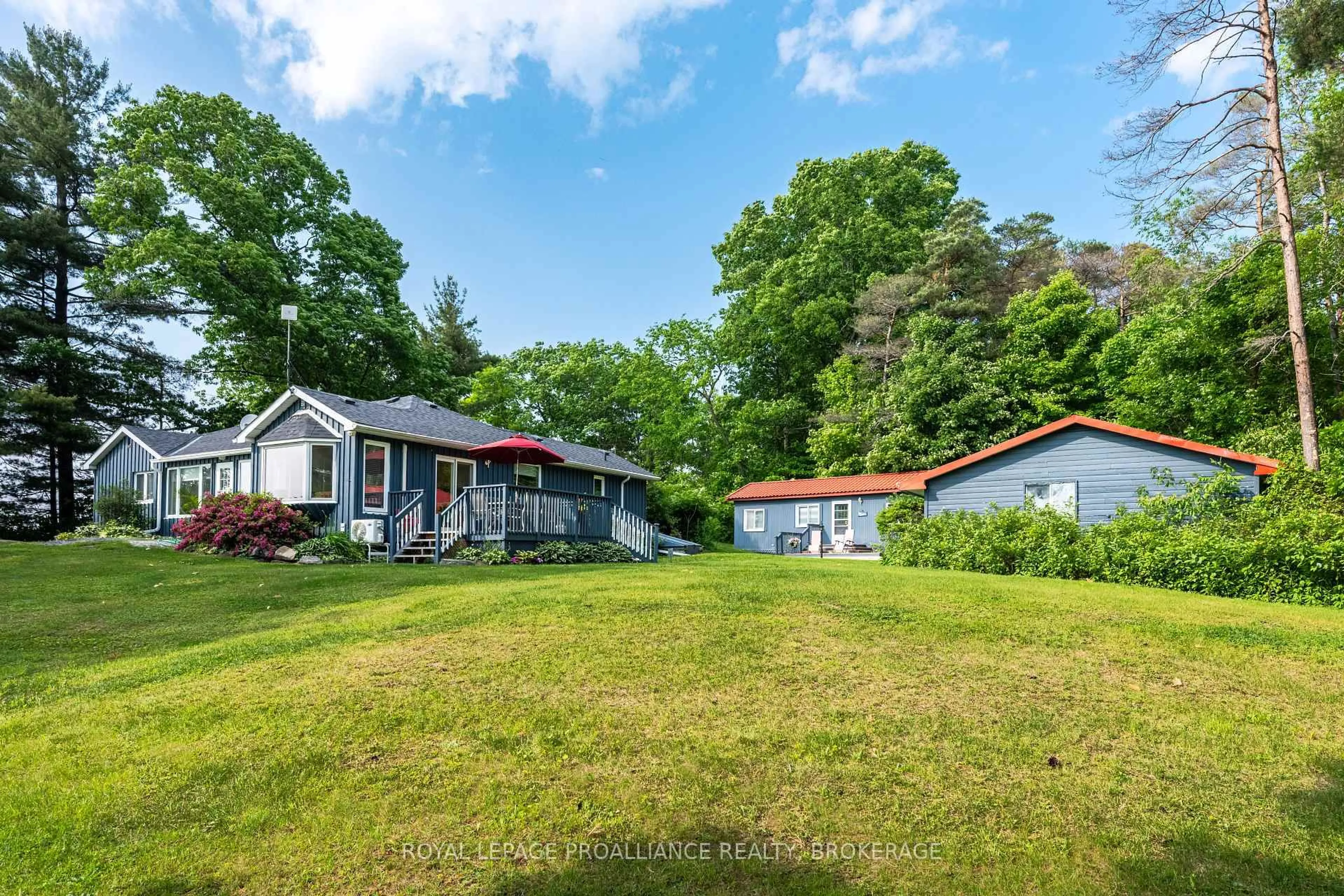 A pic from outside/outdoor area/front of a property/back of a property/a pic from drone, water/lake/river/ocean view for 4788 Leo Lake Rd, Seeley's Bay Ontario K0H 2N0