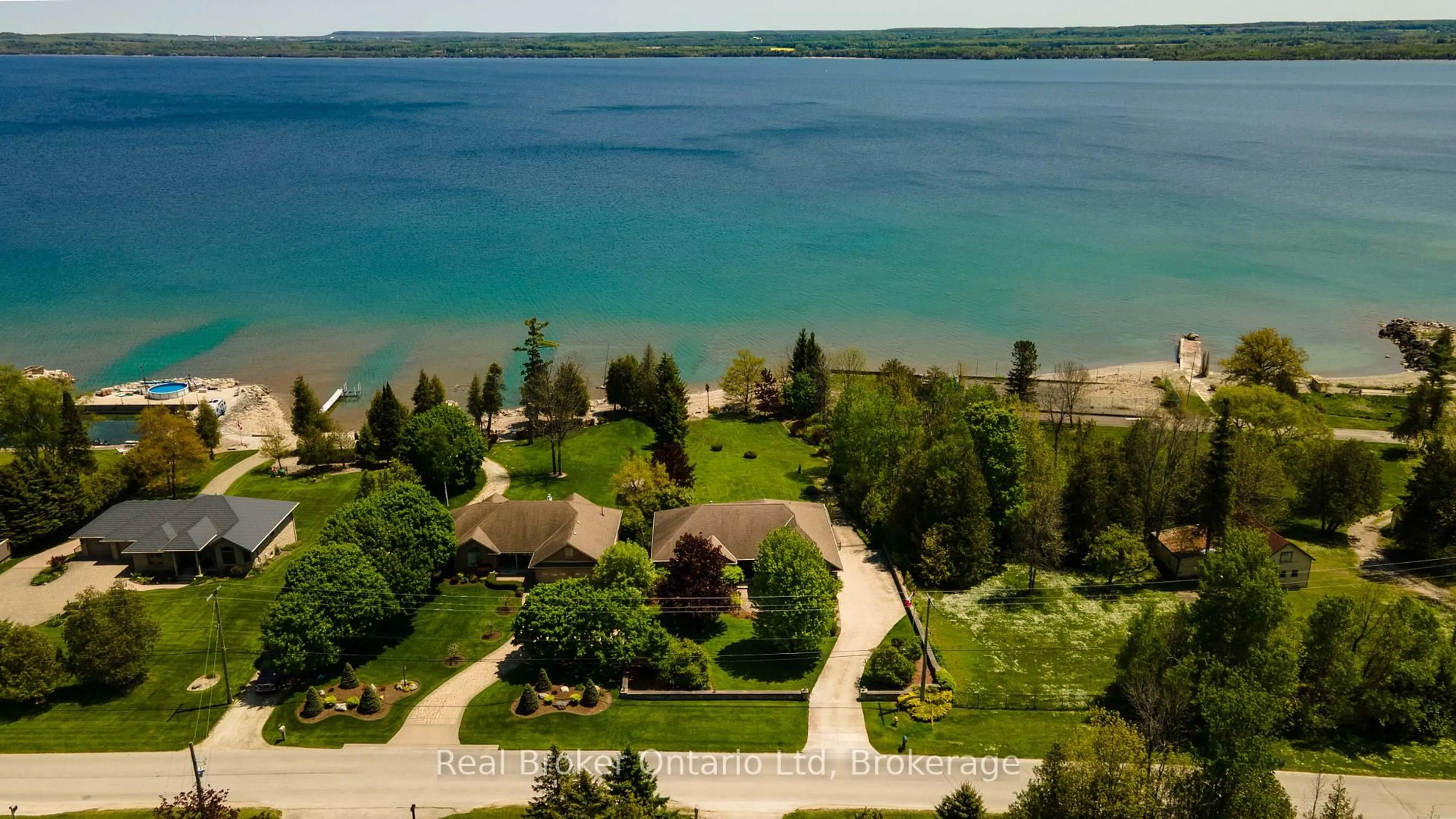 A pic from outside/outdoor area/front of a property/back of a property/a pic from drone, water/lake/river/ocean view for 361 Balmy Beach Rd, Georgian Bluffs Ontario N4K 5N4
