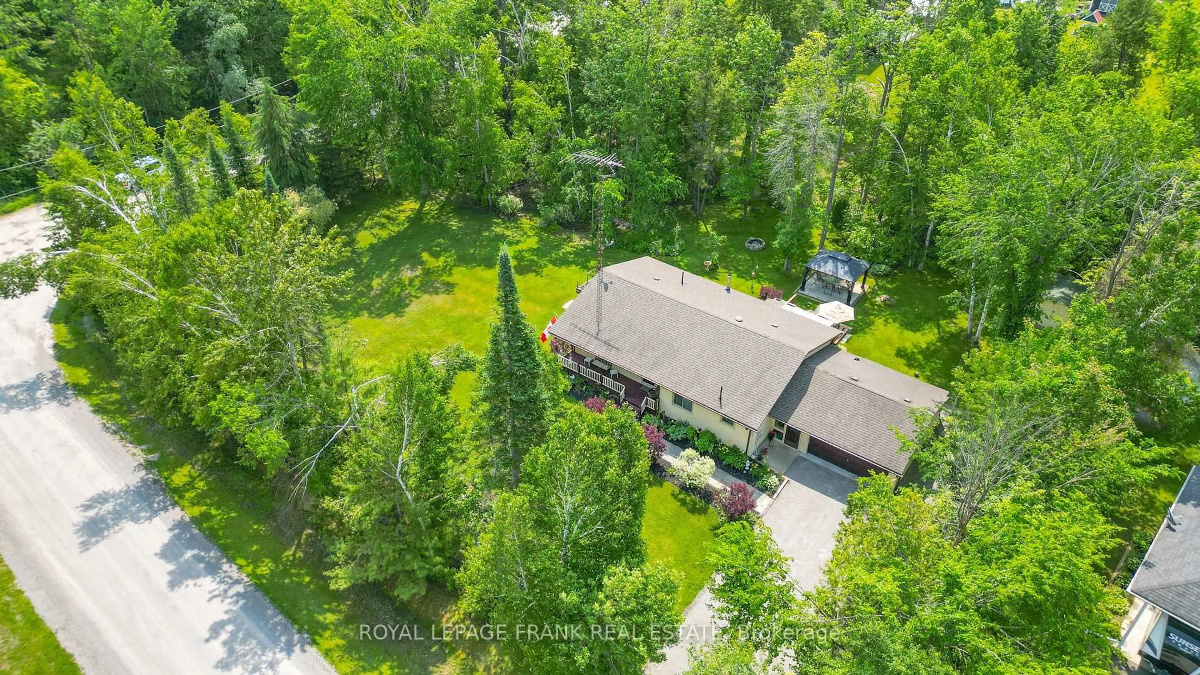A pic from outside/outdoor area/front of a property/back of a property/a pic from drone, forest/trees view for 124 Riley Lane, Kawartha Lakes Ontario K0M 2T0