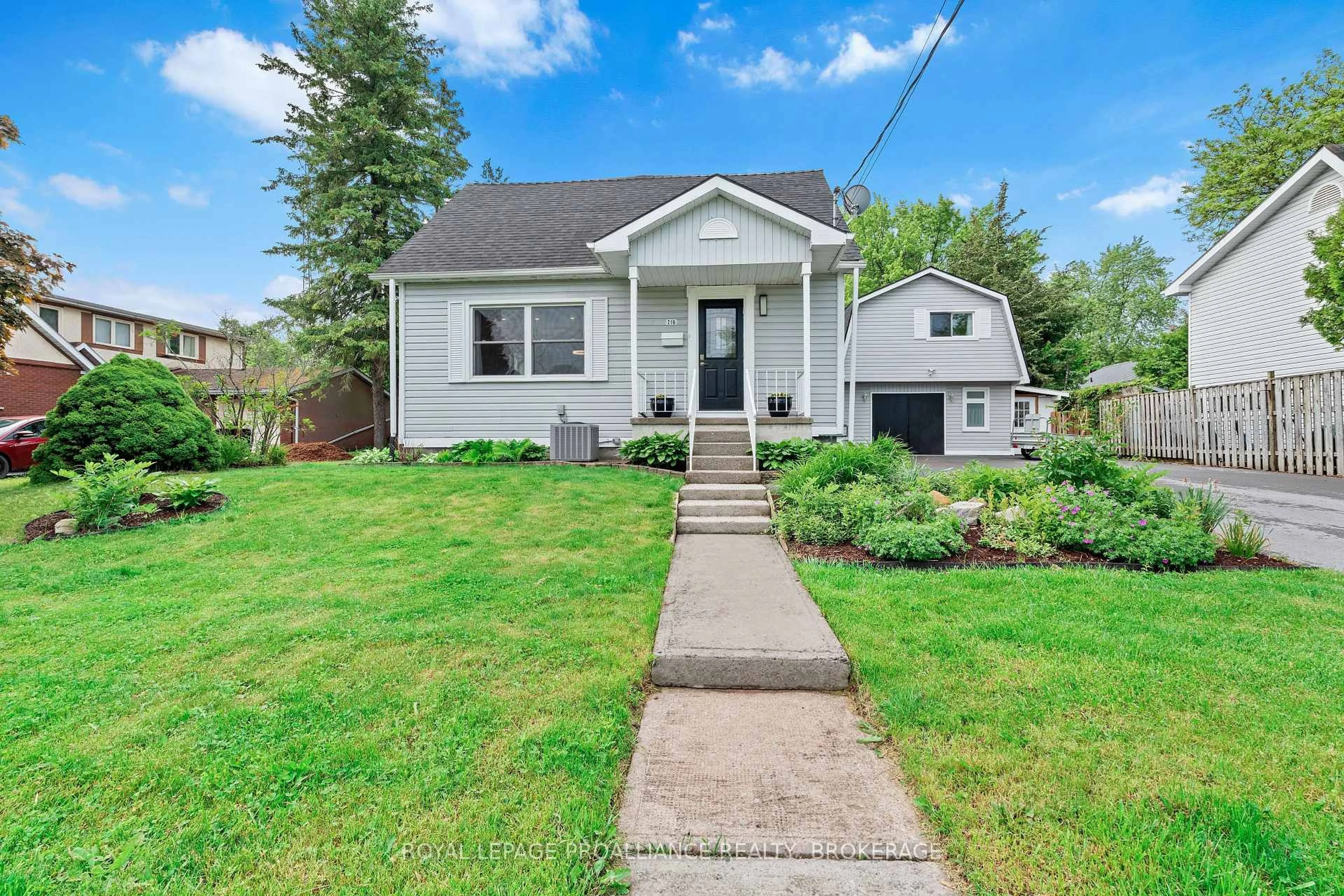 Home with vinyl exterior material, street for 216 Phillips St, Kingston Ontario K7M 3A1