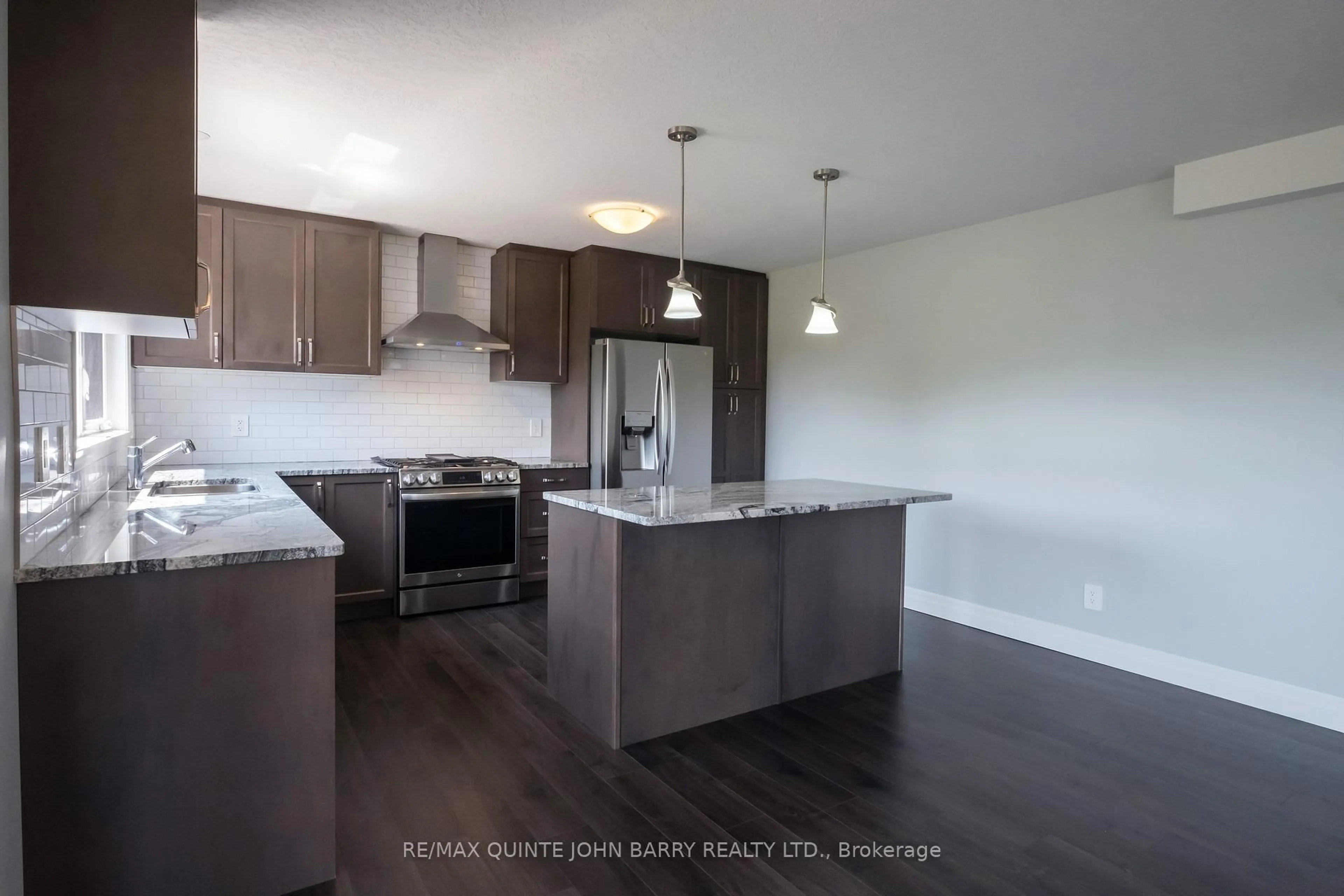 Open concept kitchen, wood/laminate floor for 49 Lanark Dr, Belleville Ontario K8N 0G8