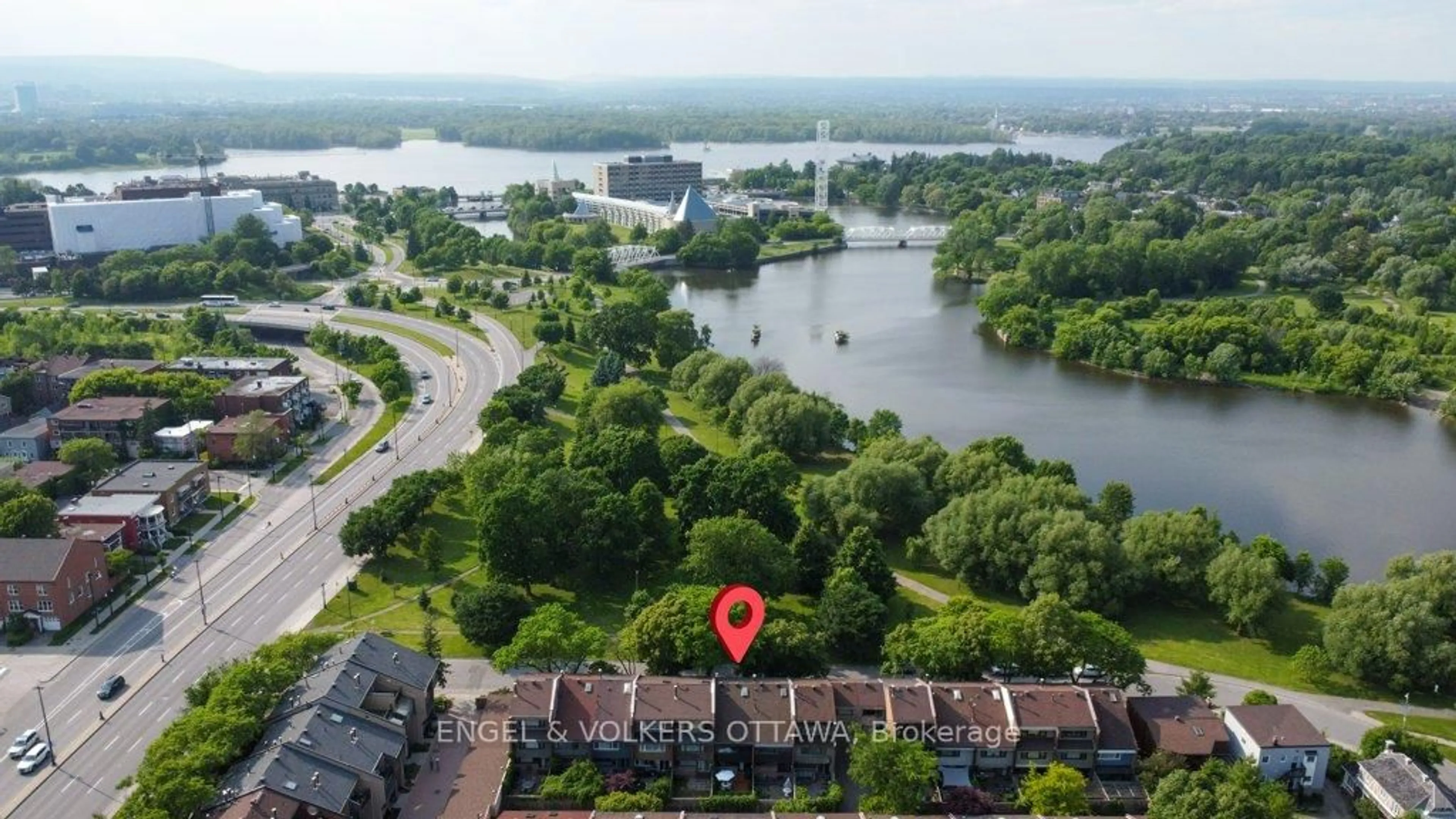 A pic from outside/outdoor area/front of a property/back of a property/a pic from drone, water/lake/river/ocean view for 304 CATHCART St, Ottawa Ontario K1N 5C4