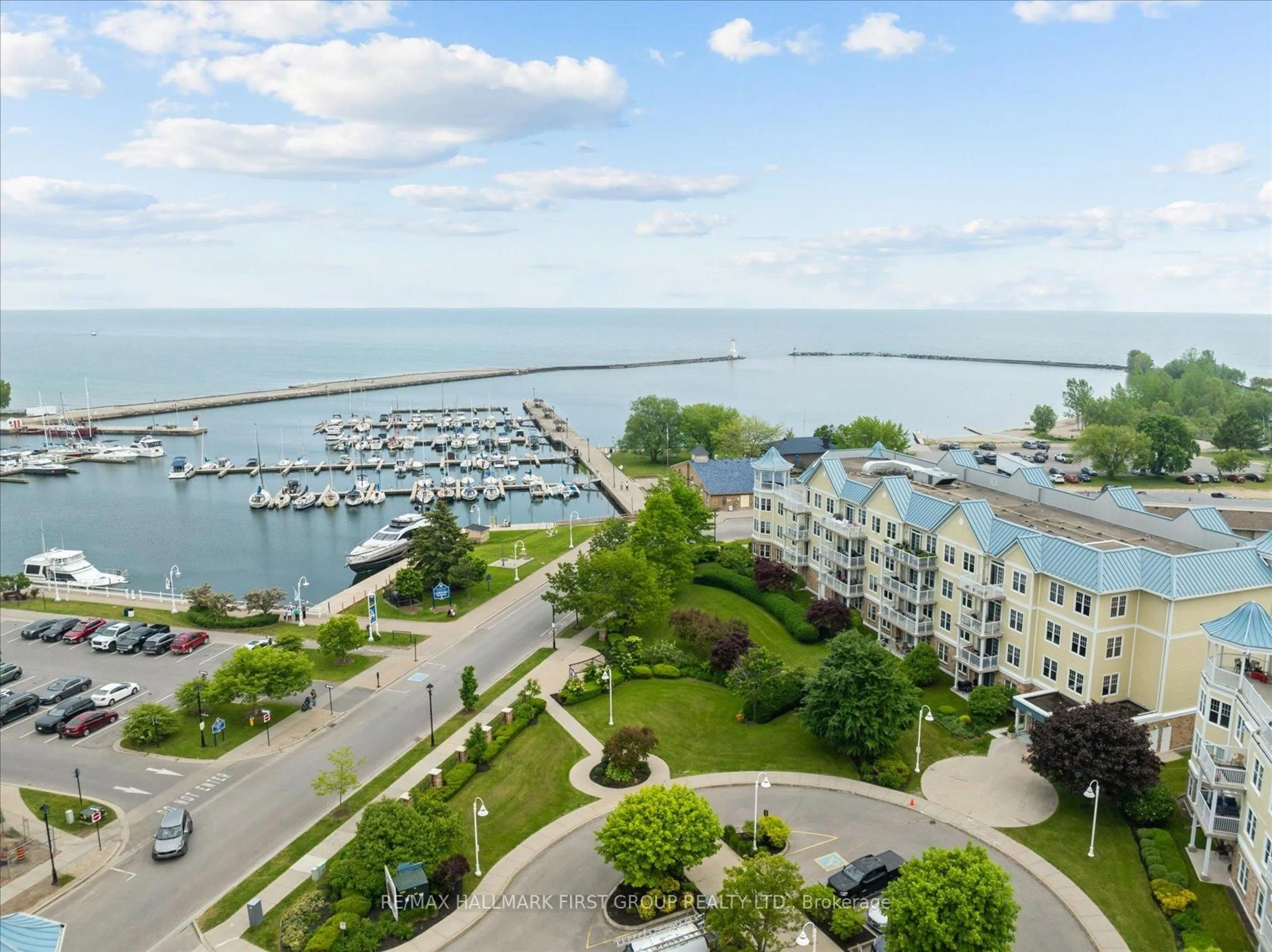 A pic from outside/outdoor area/front of a property/back of a property/a pic from drone, water/lake/river/ocean view for 125 Third St #305, Cobourg Ontario K9A 5W9