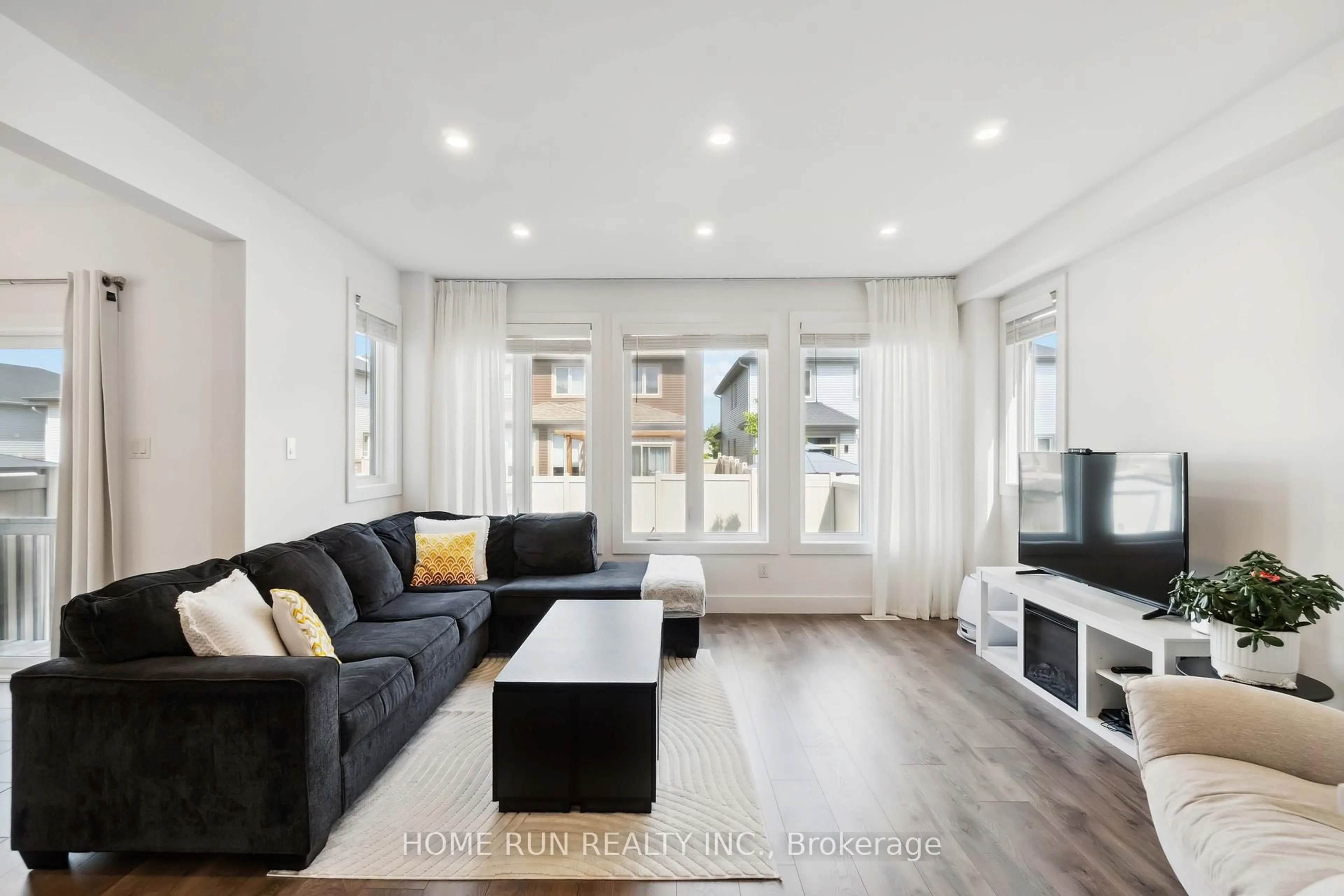 Living room with furniture, wood/laminate floor for 334 Haliburton Hts, Ottawa Ontario K2V 0G1