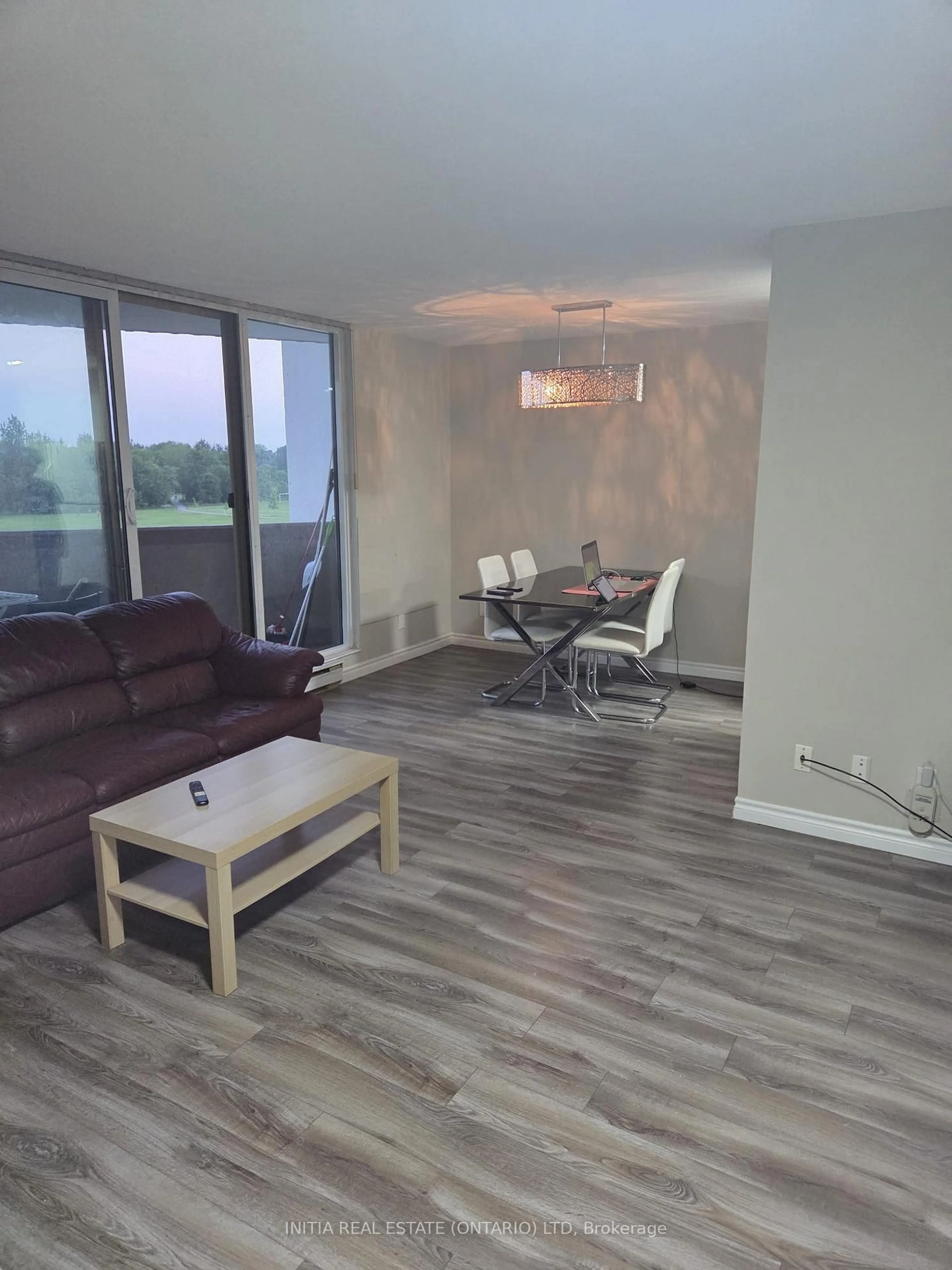Living room with furniture, wood/laminate floor for 1105 Jalna Blvd #410, London South Ontario N6E 2S9