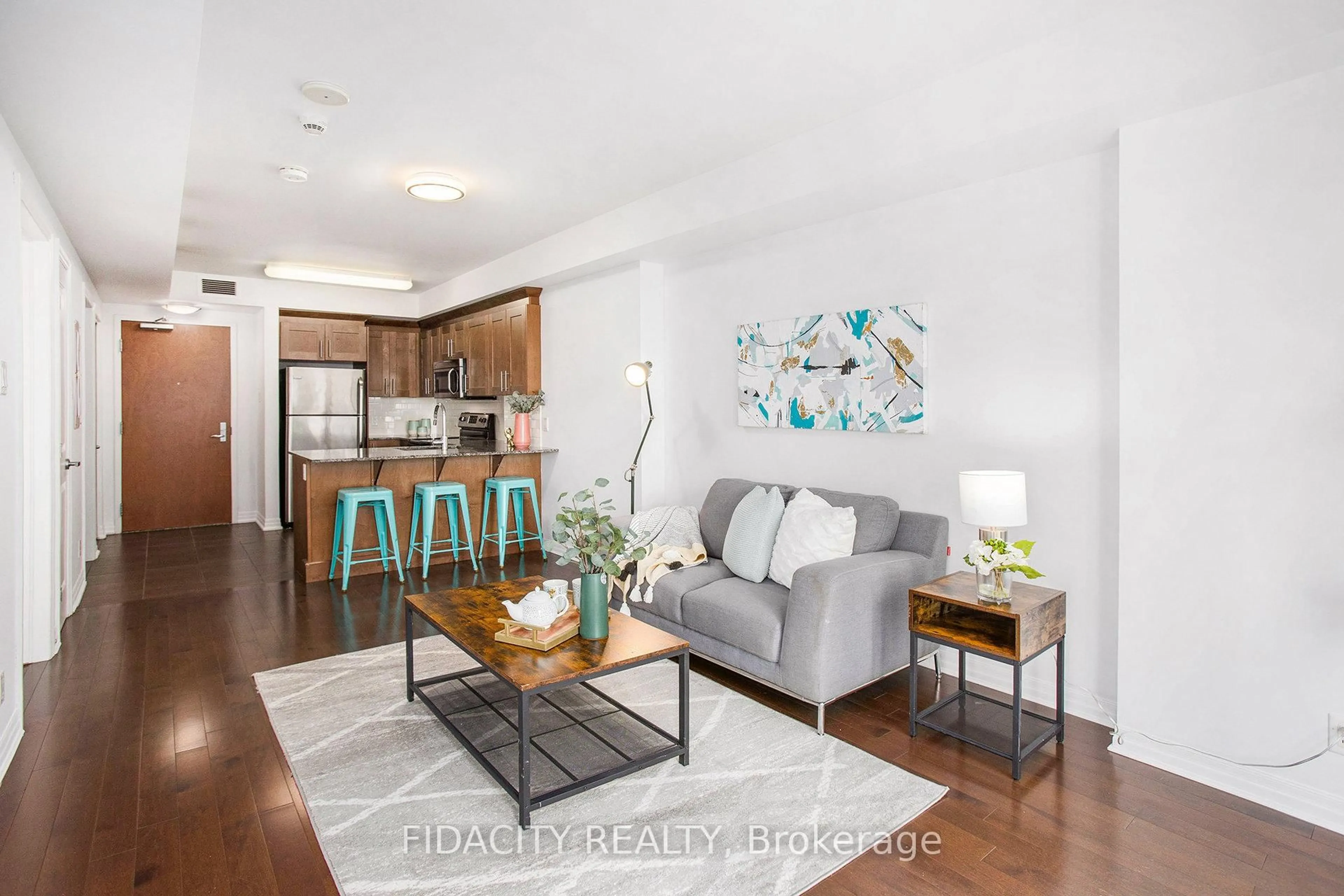 Living room with furniture, wood/laminate floor for 242 Rideau St #1105, Ottawa Ontario K1N 0B7