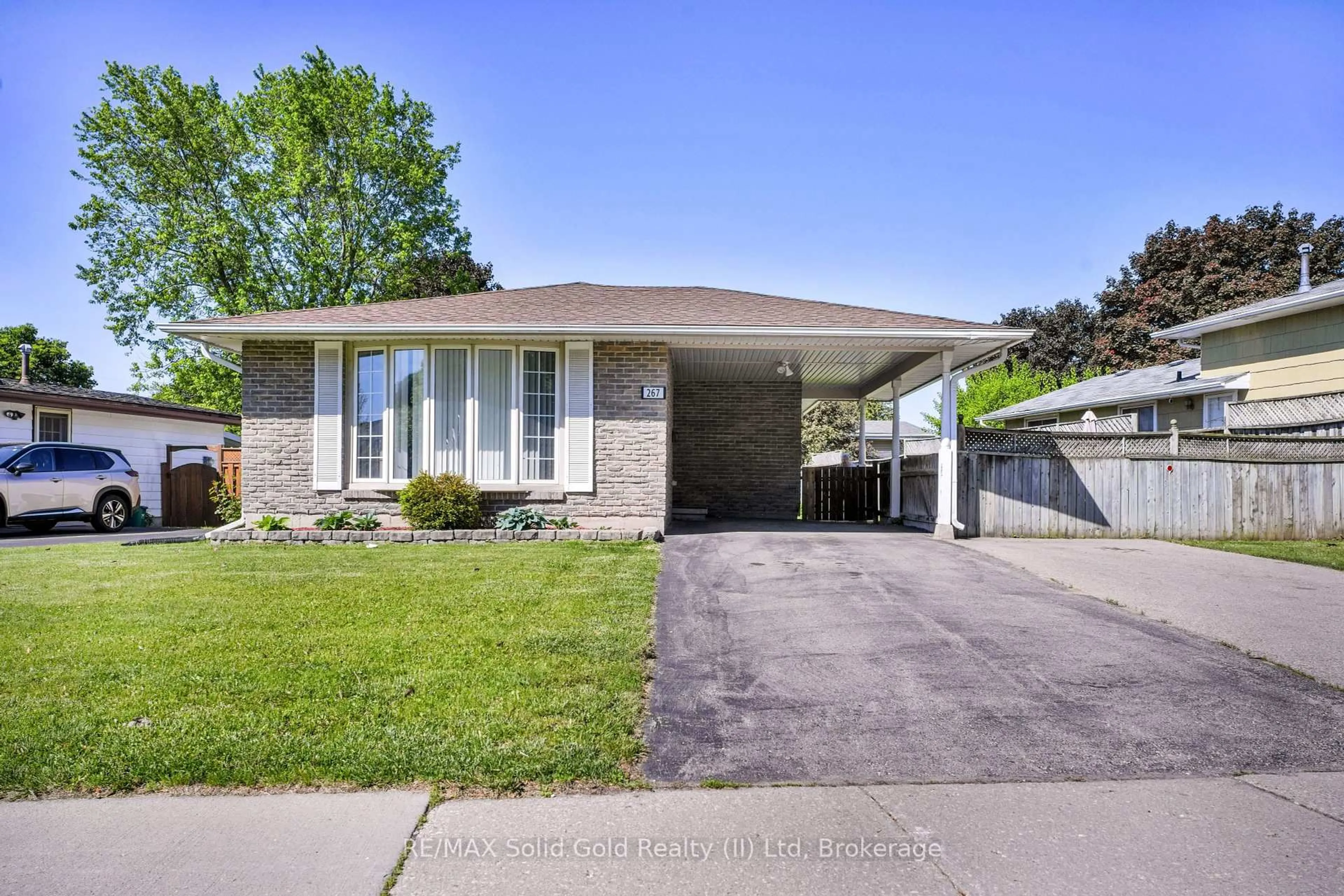 Home with brick exterior material, street for 267 Kingswood Dr, Kitchener Ontario N2E 1S1