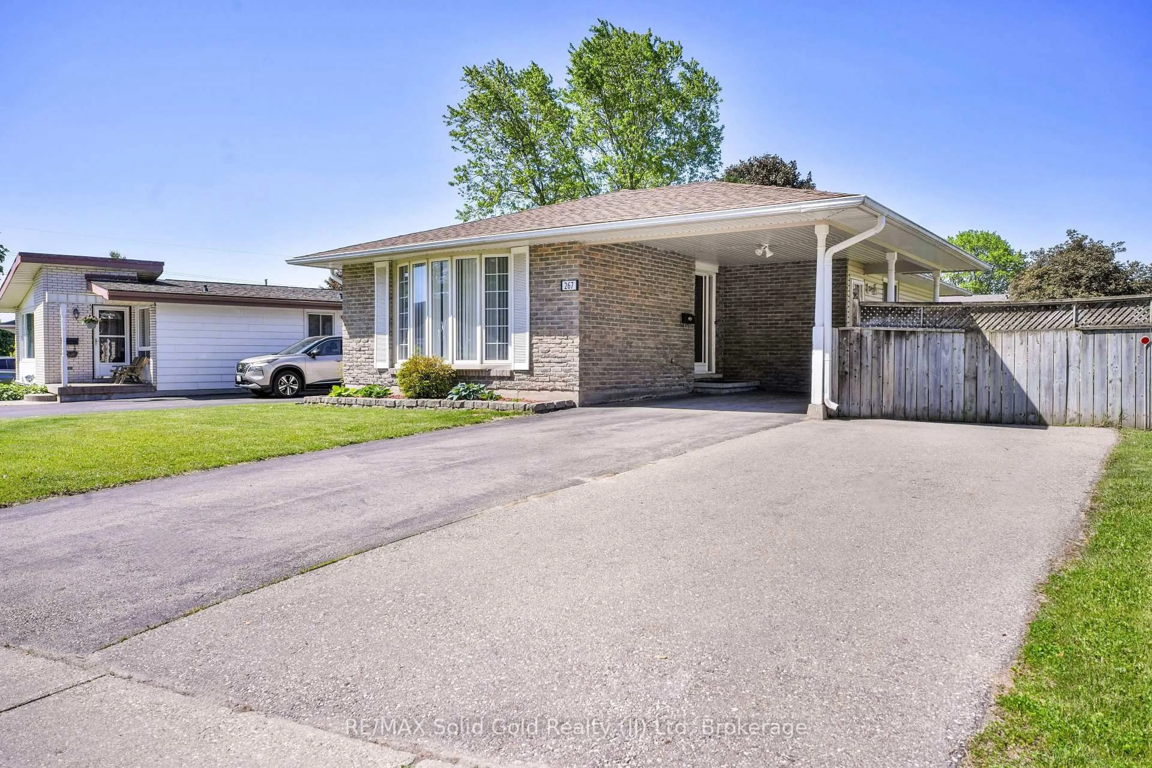 Home with brick exterior material, street for 267 Kingswood Dr, Kitchener Ontario N2E 1S1