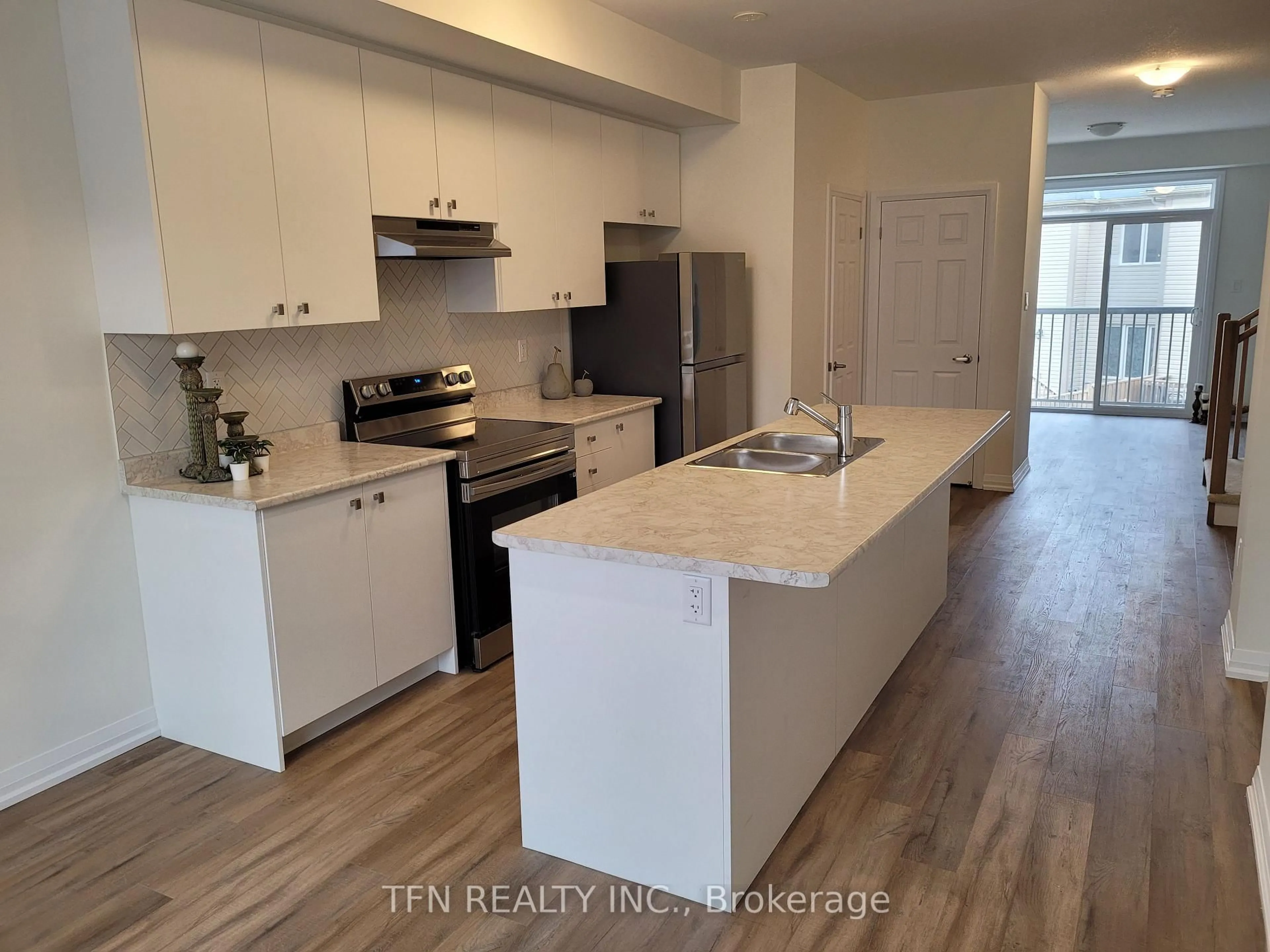 Open concept kitchen, wood/laminate floor for 389 Conklin Rd #12, Brantford Ontario N3T 0Y3