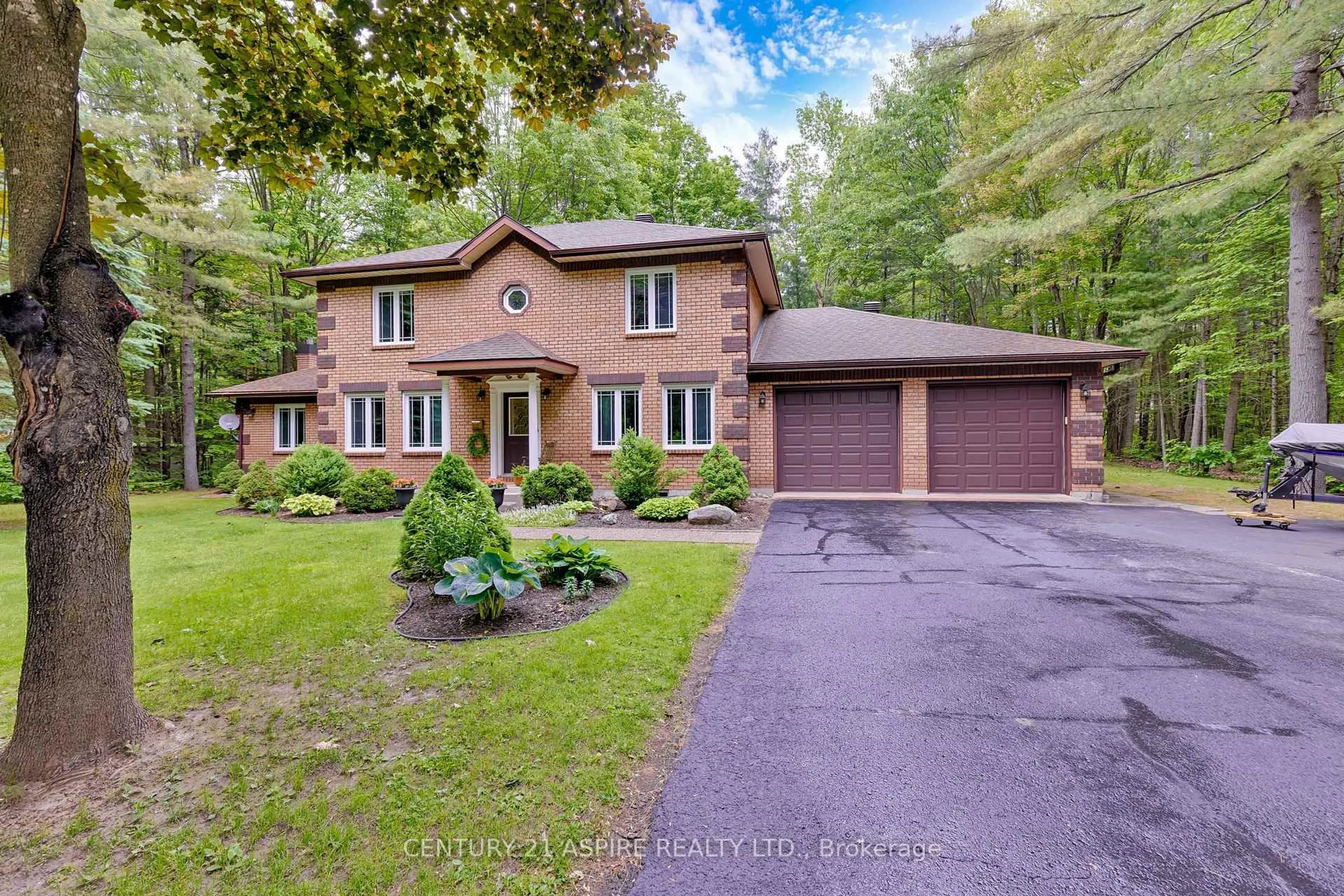 Home with brick exterior material, street for 13 Country Lane, Petawawa Ontario K8H 3E2